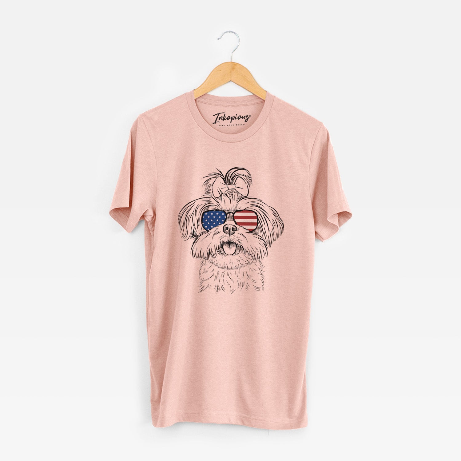 Hand-drawn sketch of Pebbles the Shorkie wearing American flag sunglasses on a Peach Unisex crewneck