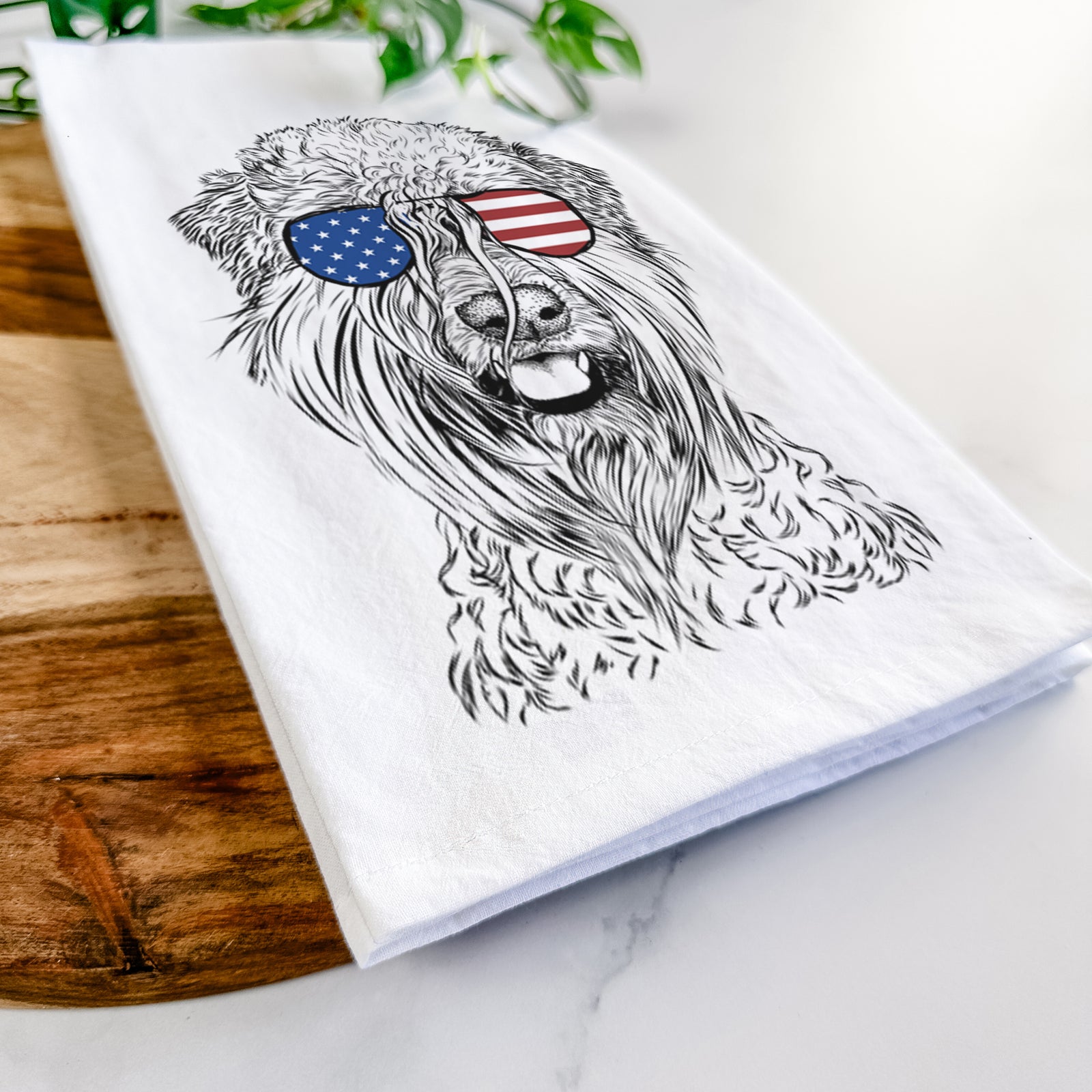 Hand-drawn sketch of Pierre the Soft Coated Wheaten Terrier wearing American flag sunglasses on a tea towel