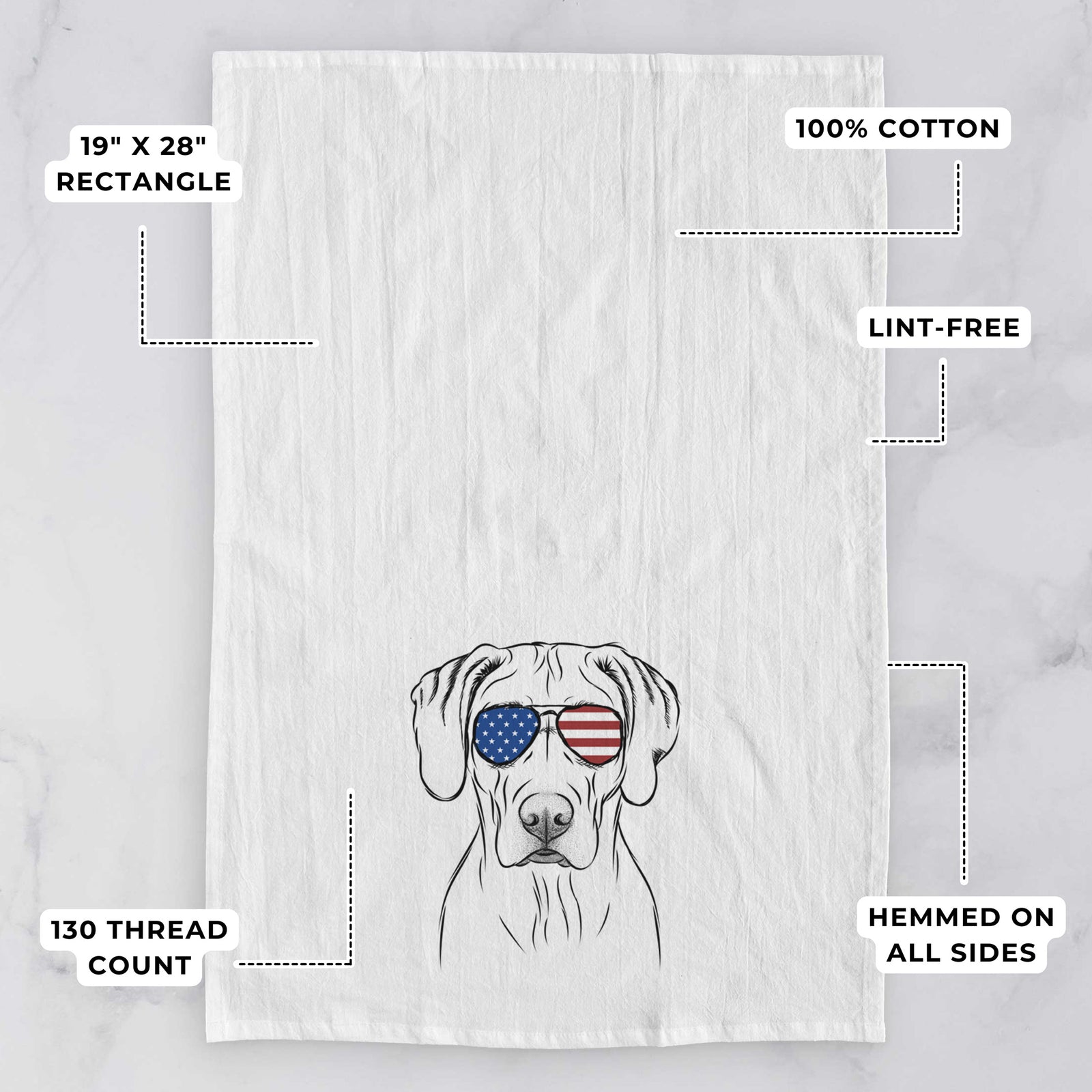 Hand-drawn sketch of Reid the Rhodesian Ridgeback wearing American flag sunglasses on a tea towel, with feature callouts: 19 x 28 inch rectangle, 100% cotton, lint-free, 120 thread count, hemmed on all sides