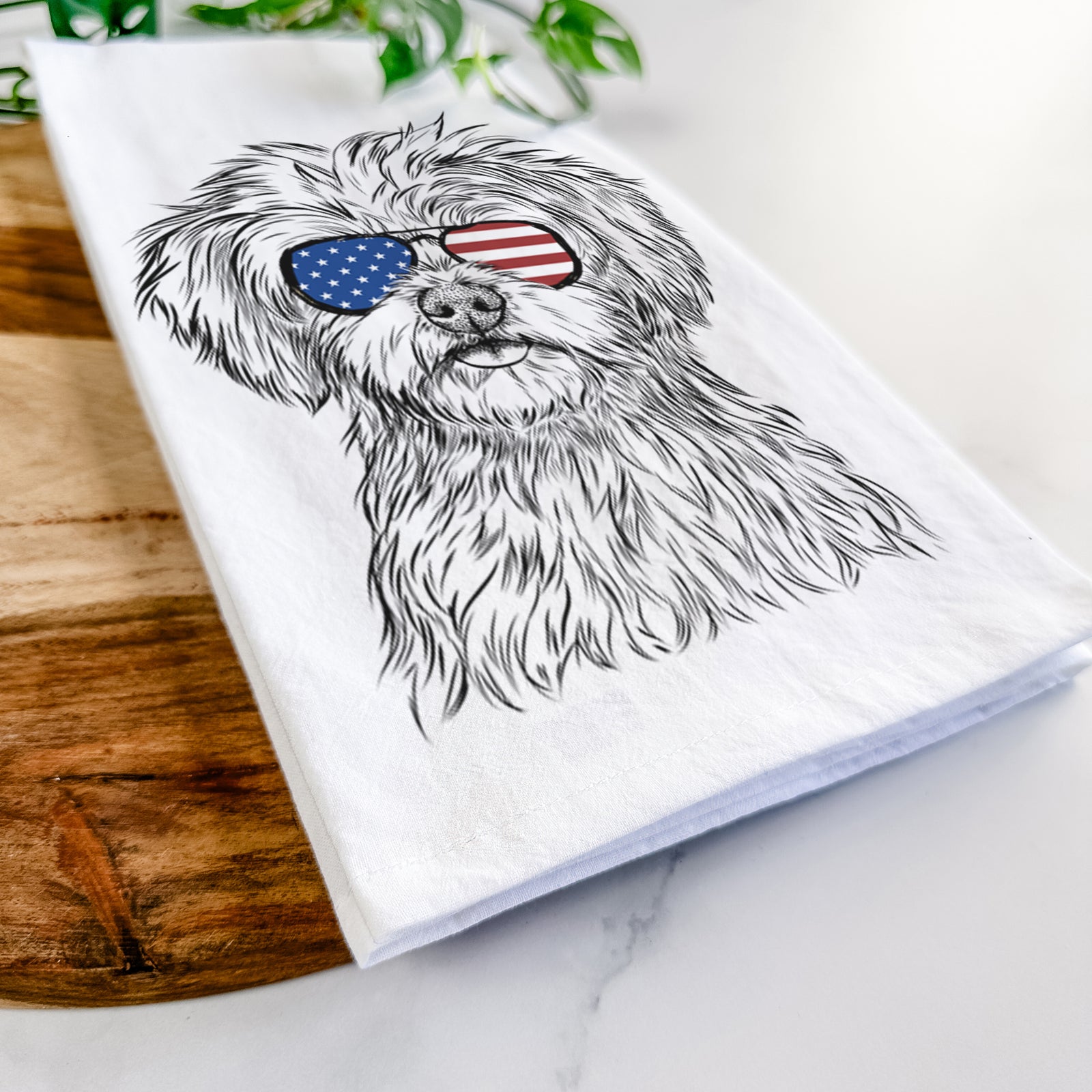 Hand-drawn sketch of Sammy the Shorkie wearing American flag sunglasses on a tea towel