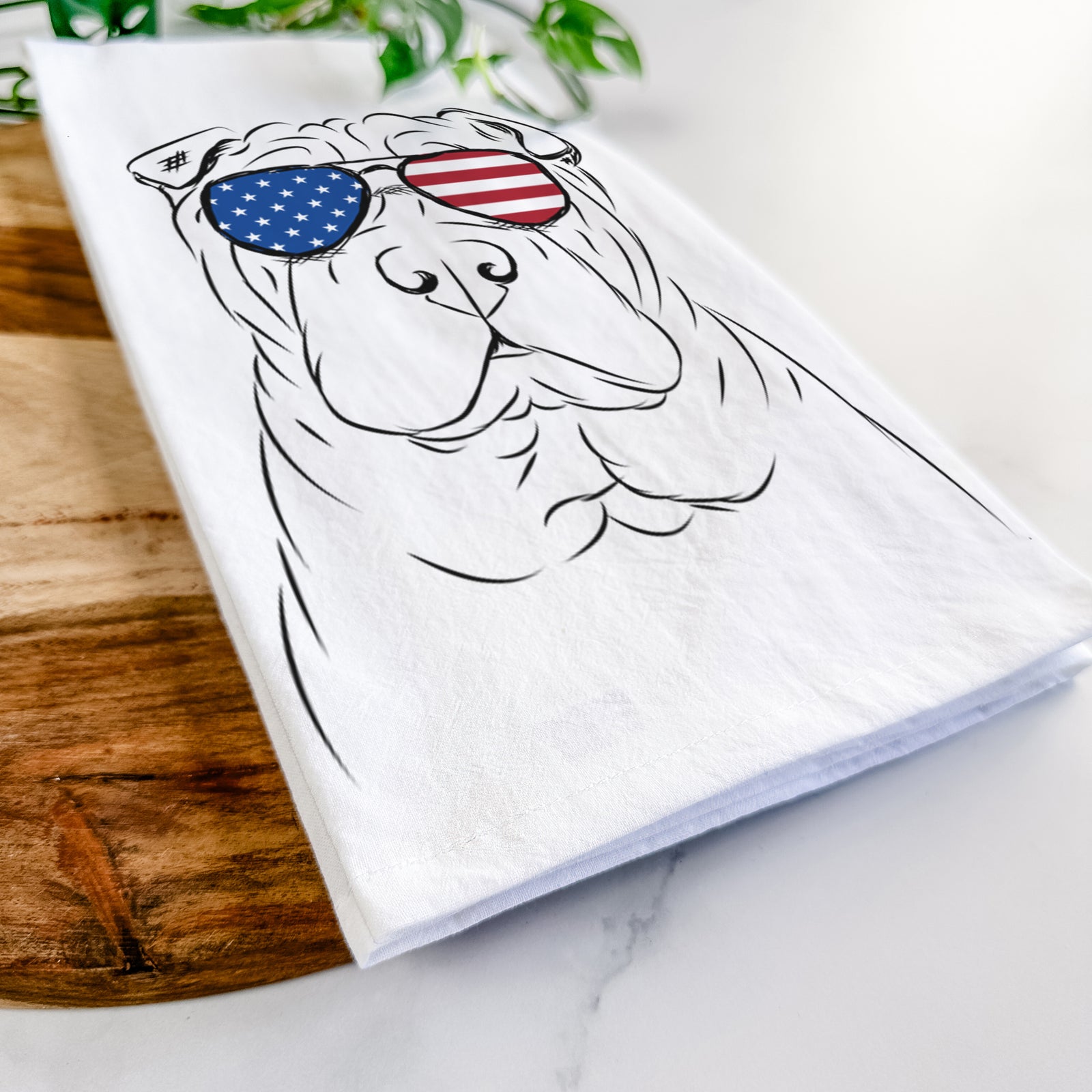 Hand-drawn sketch of Sharpy the Shar Pei wearing American flag sunglasses on a tea towel