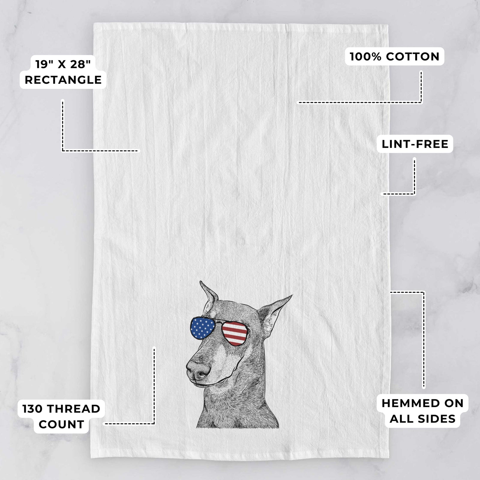 Hand-drawn sketch of Shelby the Doberman Pinscher wearing American flag sunglasses on a tea towel, with feature callouts: 19 x 28 inch rectangle, 100% cotton, lint-free, 120 thread count, hemmed on all sides