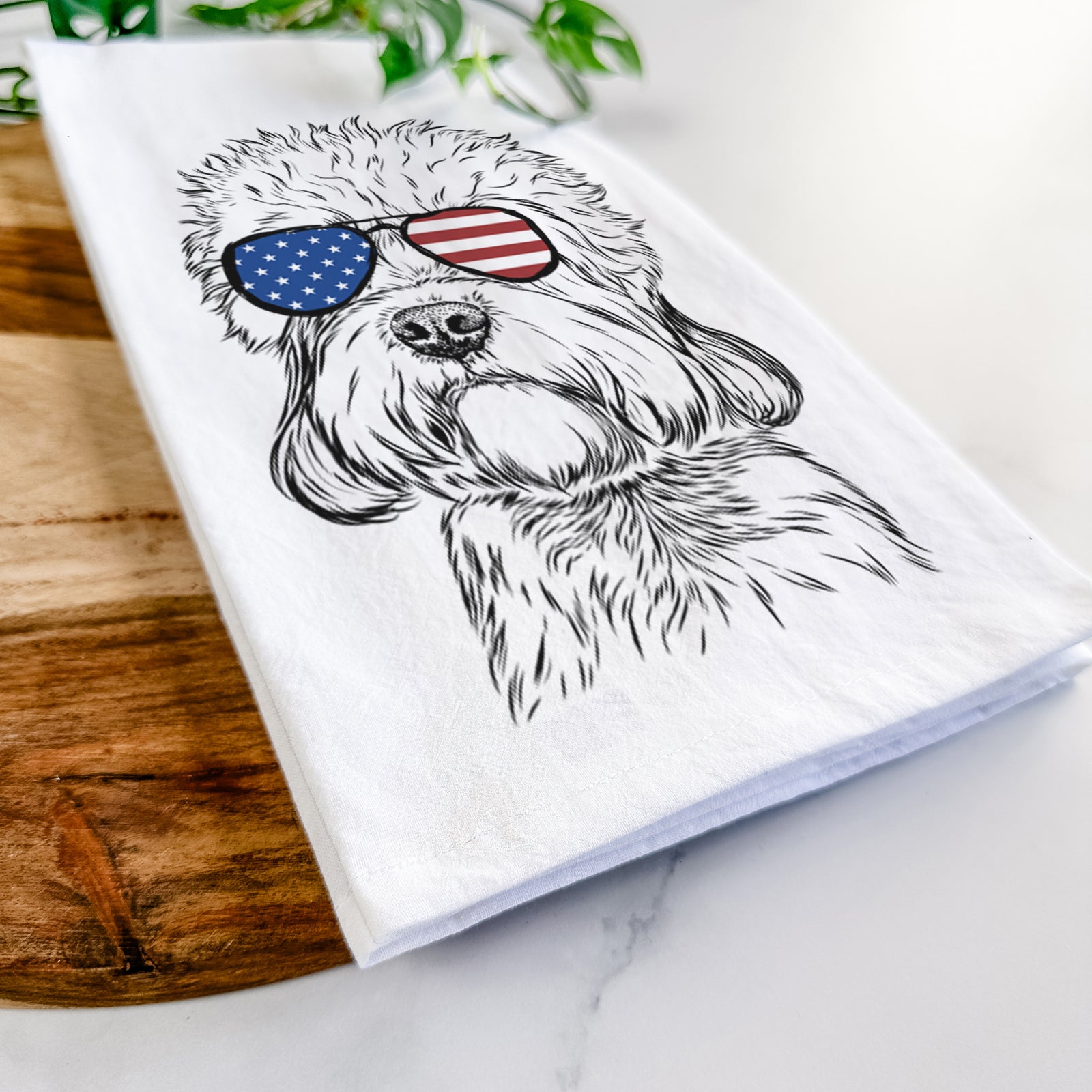 Hand-drawn sketch of Sir Walter the Dandie Dinmont Terrier wearing American flag sunglasses on a tea towel
