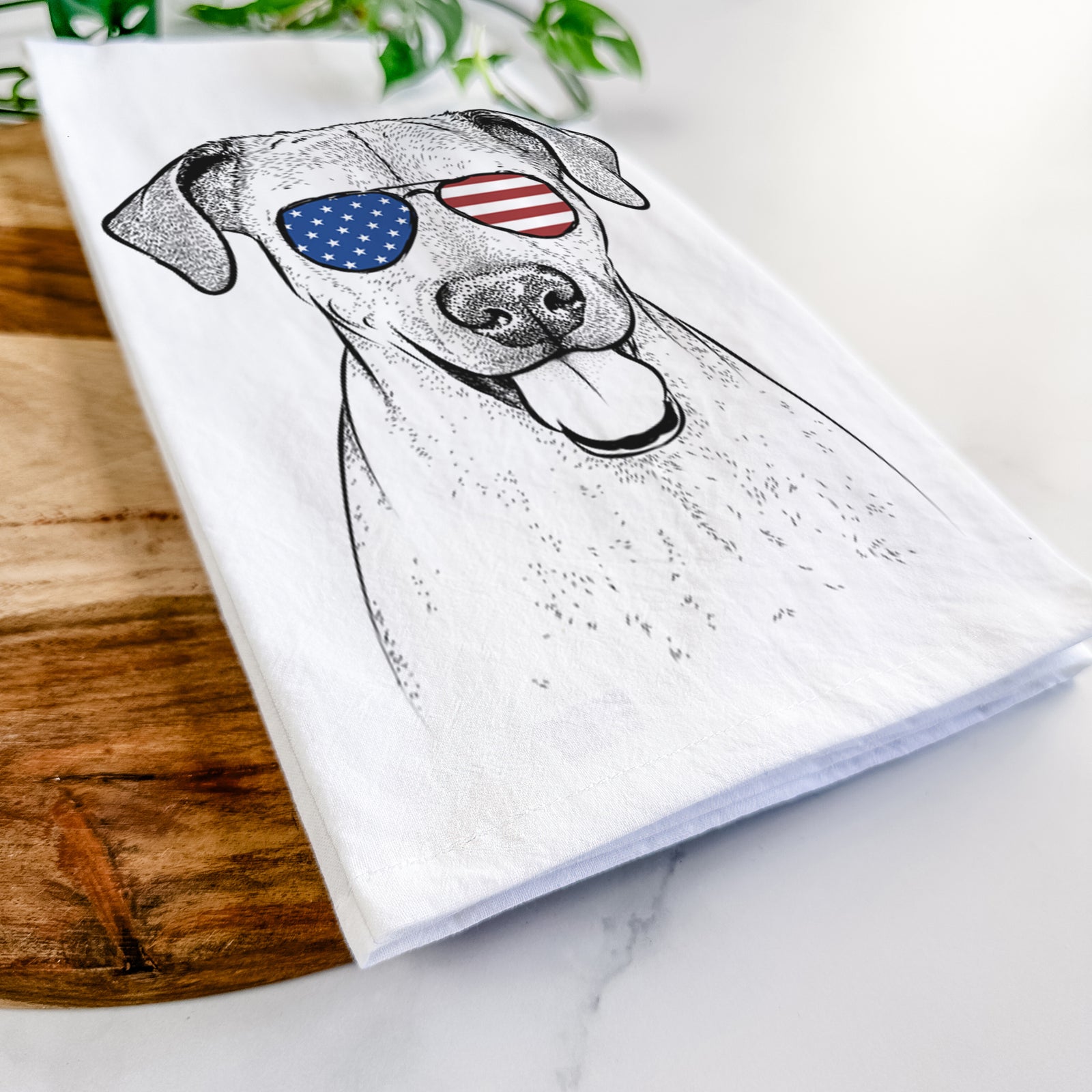 Hand-drawn sketch of Sugar the American Staffordshire Mix wearing American flag sunglasses on a tea towel