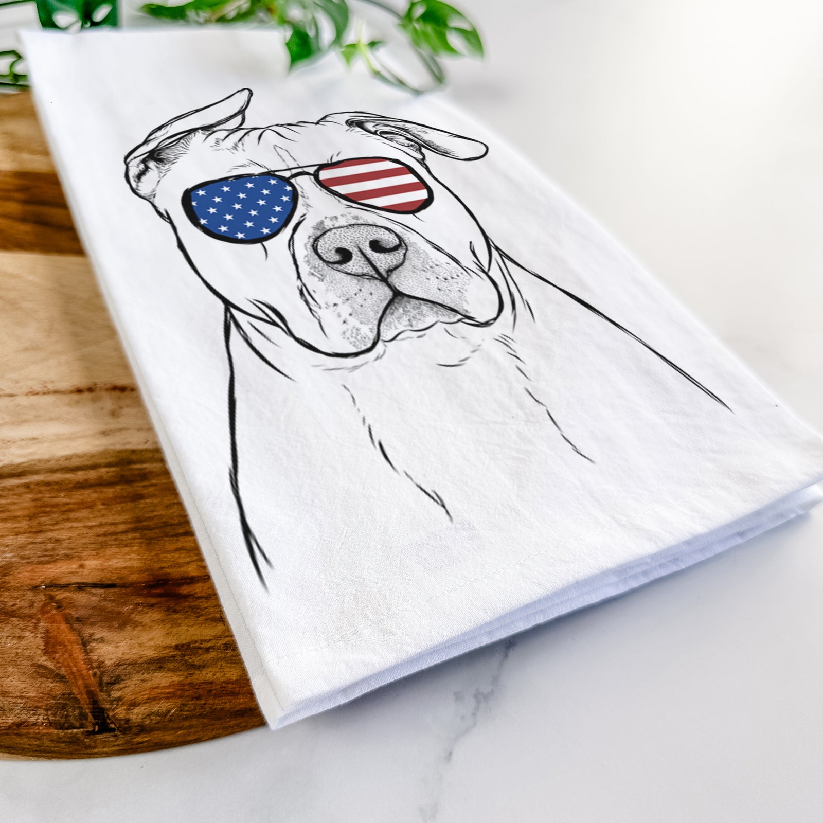 Hand-drawn sketch of Teddy Jam the Pitbull wearing American flag sunglasses on a tea towel