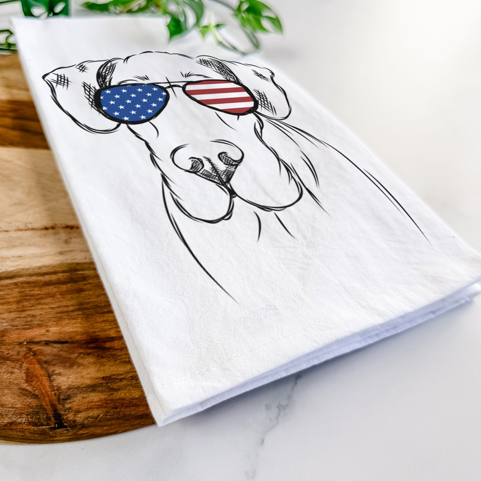 Hand-drawn sketch of Titus the Great Dane wearing American flag sunglasses on a tea towel