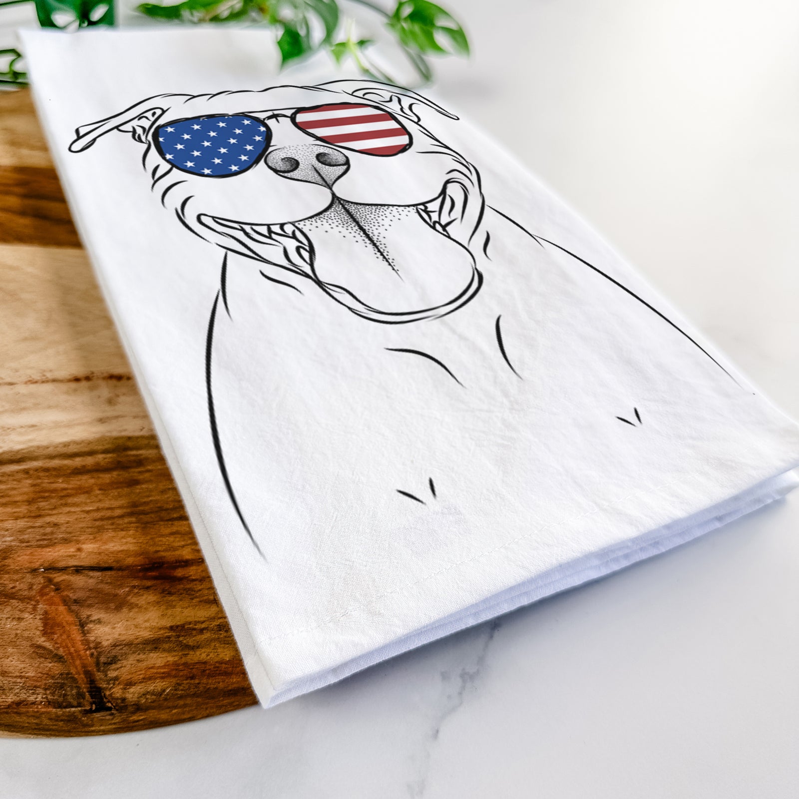 Hand-drawn sketch of Wafer the Staffordshire Bull Terrier wearing American flag sunglasses on a tea towel