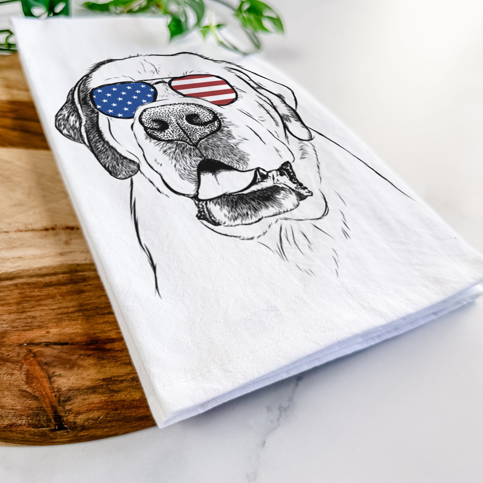 Hand-drawn sketch of Wendy the Saint Bernard wearing American flag sunglasses on a tea towel