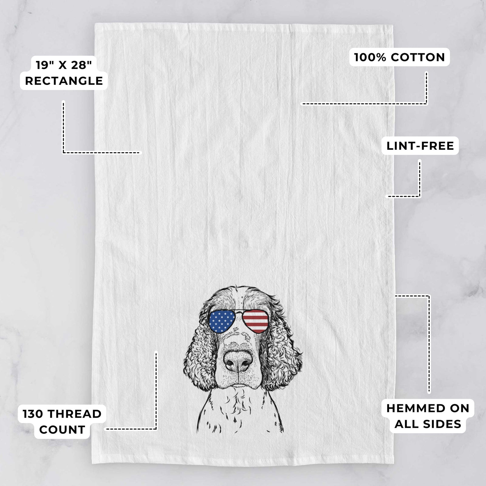 Hand-drawn sketch of Wilbur the English Springer Spaniel wearing American flag sunglasses on a tea towel, with feature callouts: 19 x 28 inch rectangle, 100% cotton, lint-free, 120 thread count, hemmed on all sides