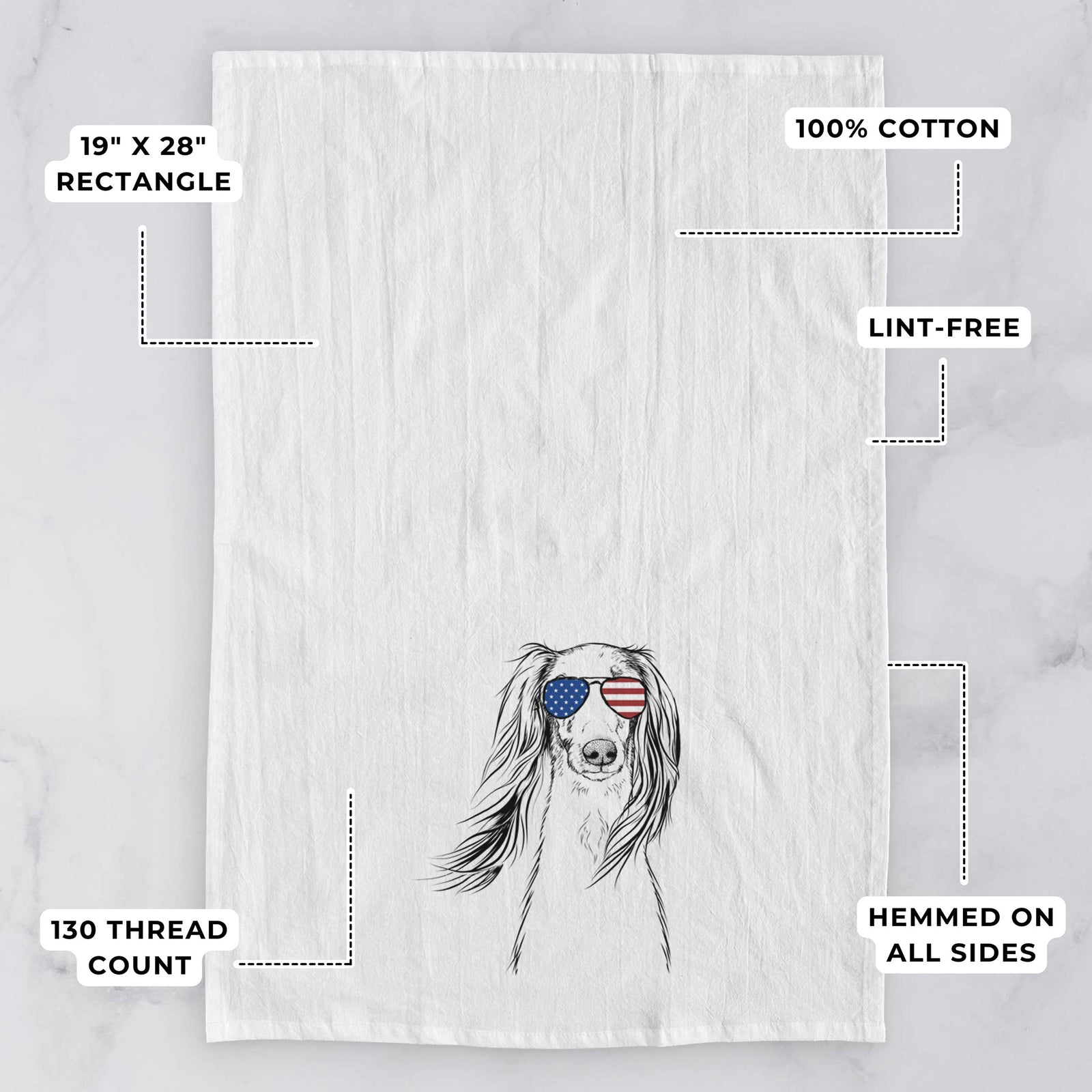 Hand-drawn sketch of Zahra the Saluki wearing American flag sunglasses on a tea towel, with feature callouts: 19 x 28 inch rectangle, 100% cotton, lint-free, 120 thread count, hemmed on all sides