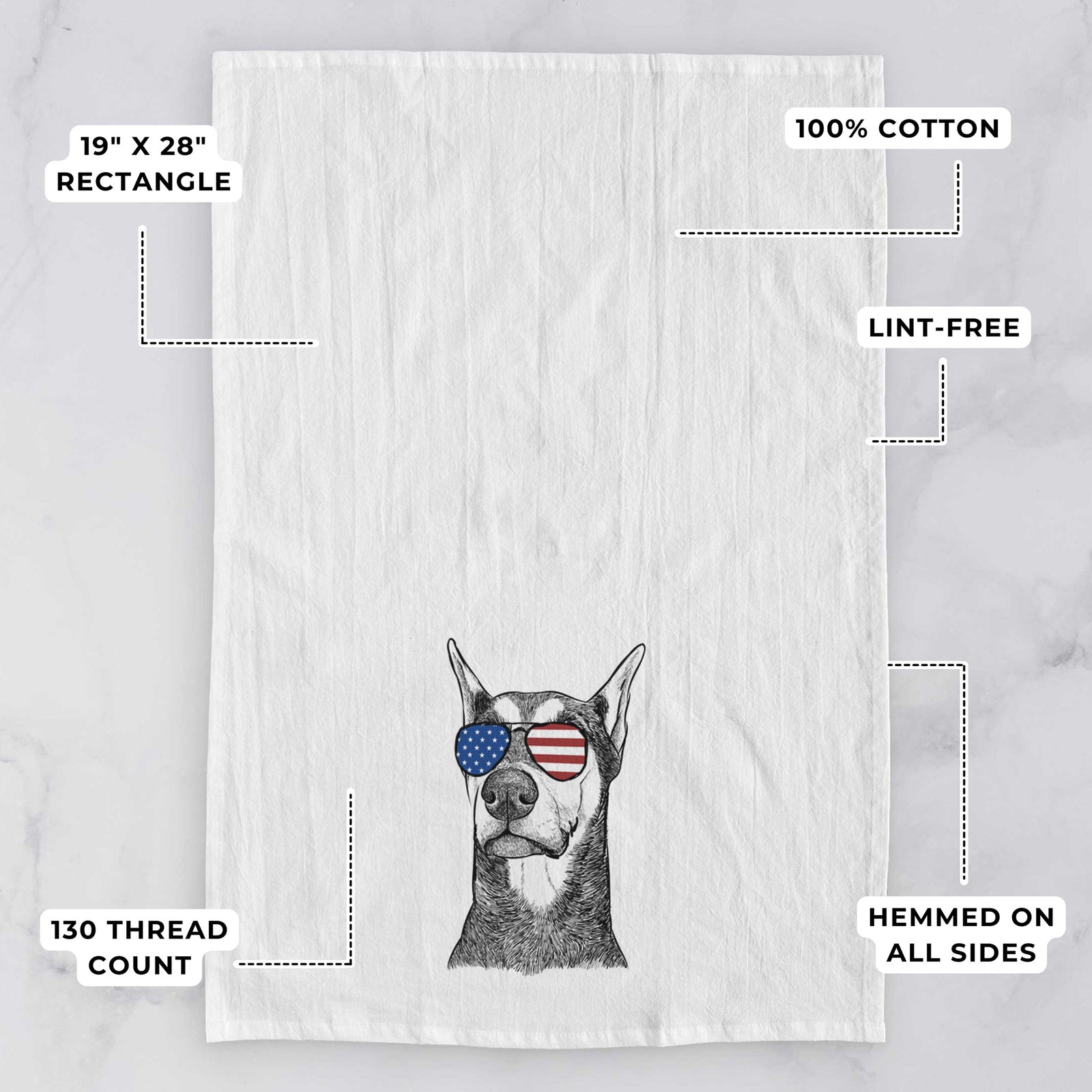 Hand-drawn sketch of Zeus the Doberman Pinscher wearing American flag sunglasses on a tea towel, with feature callouts: 19 x 28 inch rectangle, 100% cotton, lint-free, 120 thread count, hemmed on all sides