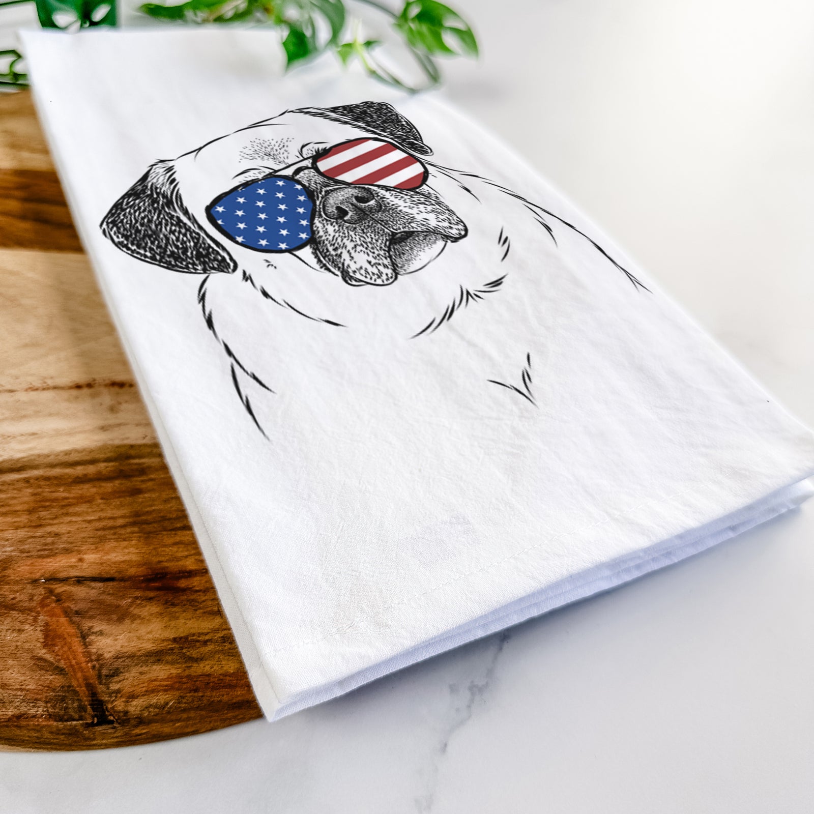 Hand-drawn sketch of Zoey the Pug wearing American flag sunglasses on a tea towel