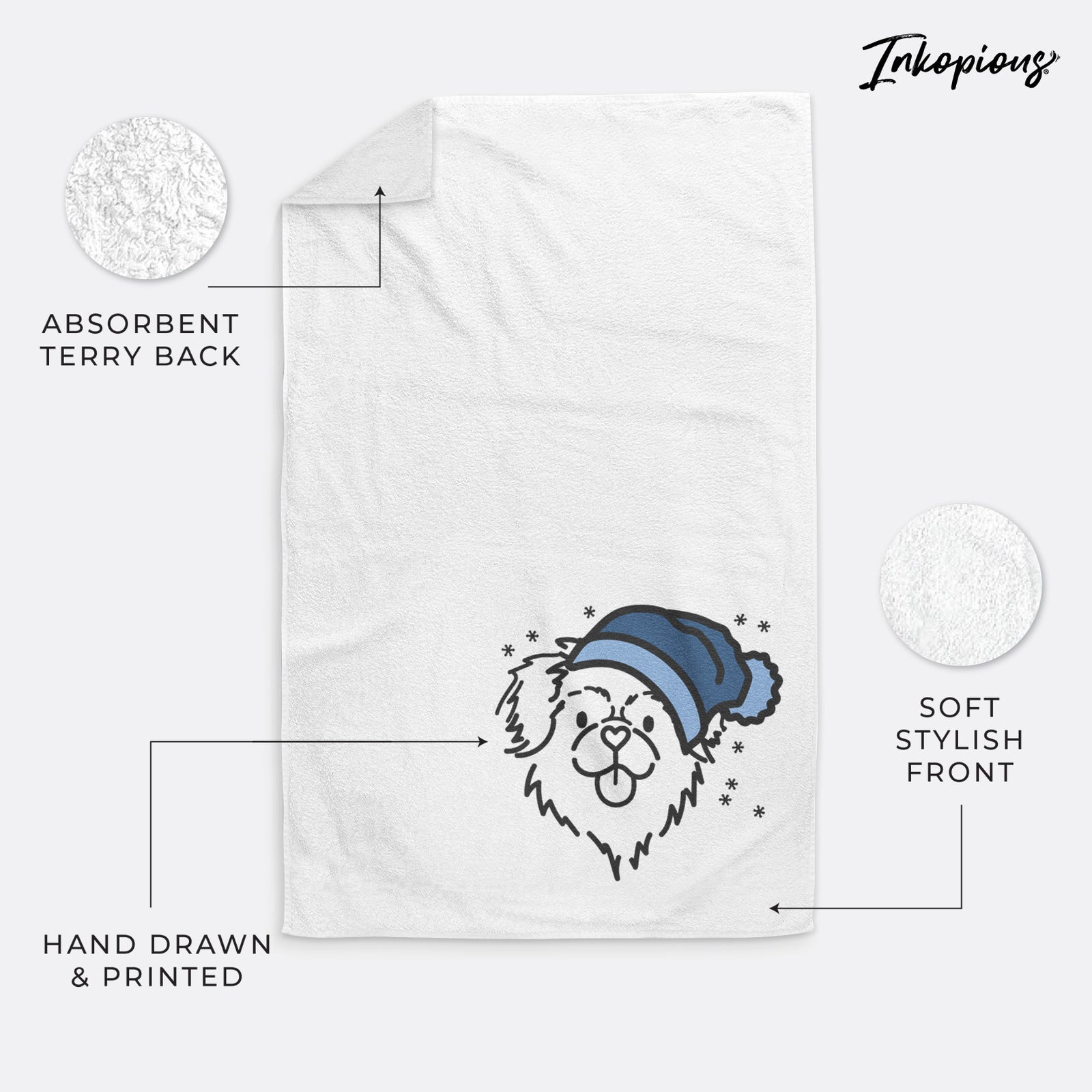 Minimalist line drawing of Jiji the Tibetan Spaniel wearing a winter beanie on a decorative hand towel