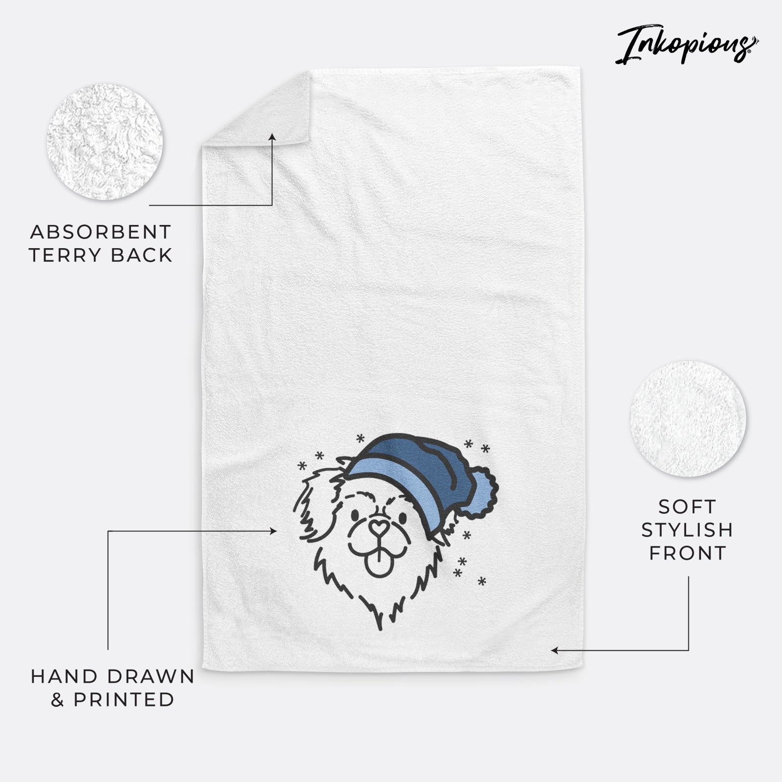 Minimalist line drawing of Jiji the Tibetan Spaniel wearing a winter beanie on a decorative hand towel