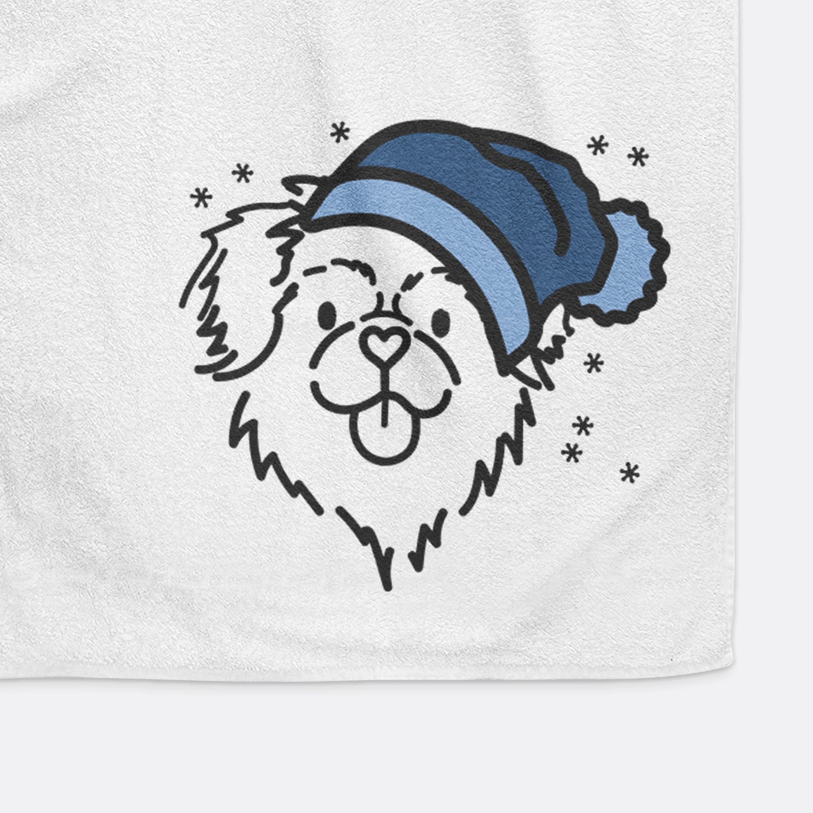 Minimalist line drawing of Jiji the Tibetan Spaniel wearing a winter beanie on a decorative hand towel