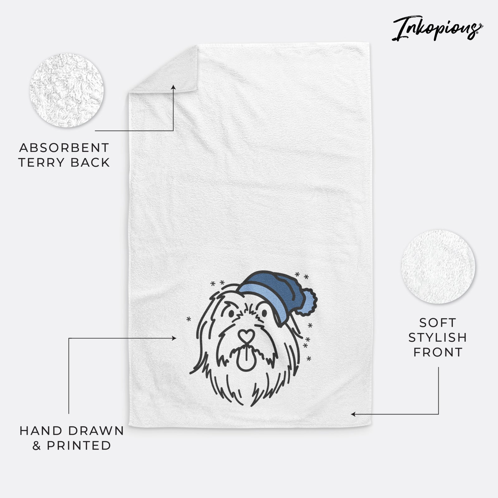 Minimalist line drawing of Tucker the Bearded Collie wearing a winter beanie on a decorative hand towel