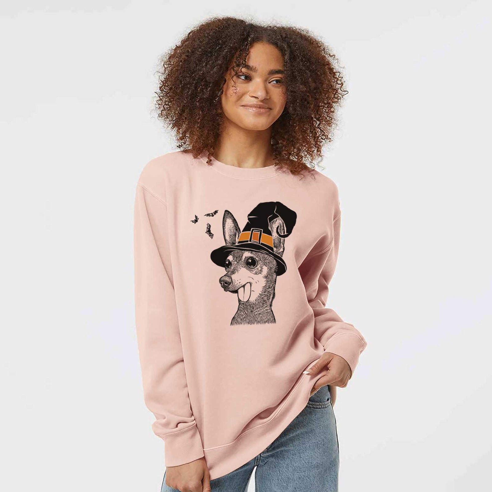 Hand-drawn sketch of Aaron the Chihuahua wearing a witch hat on a Dusty Pink Unisex pigment dyed crew sweatshirt