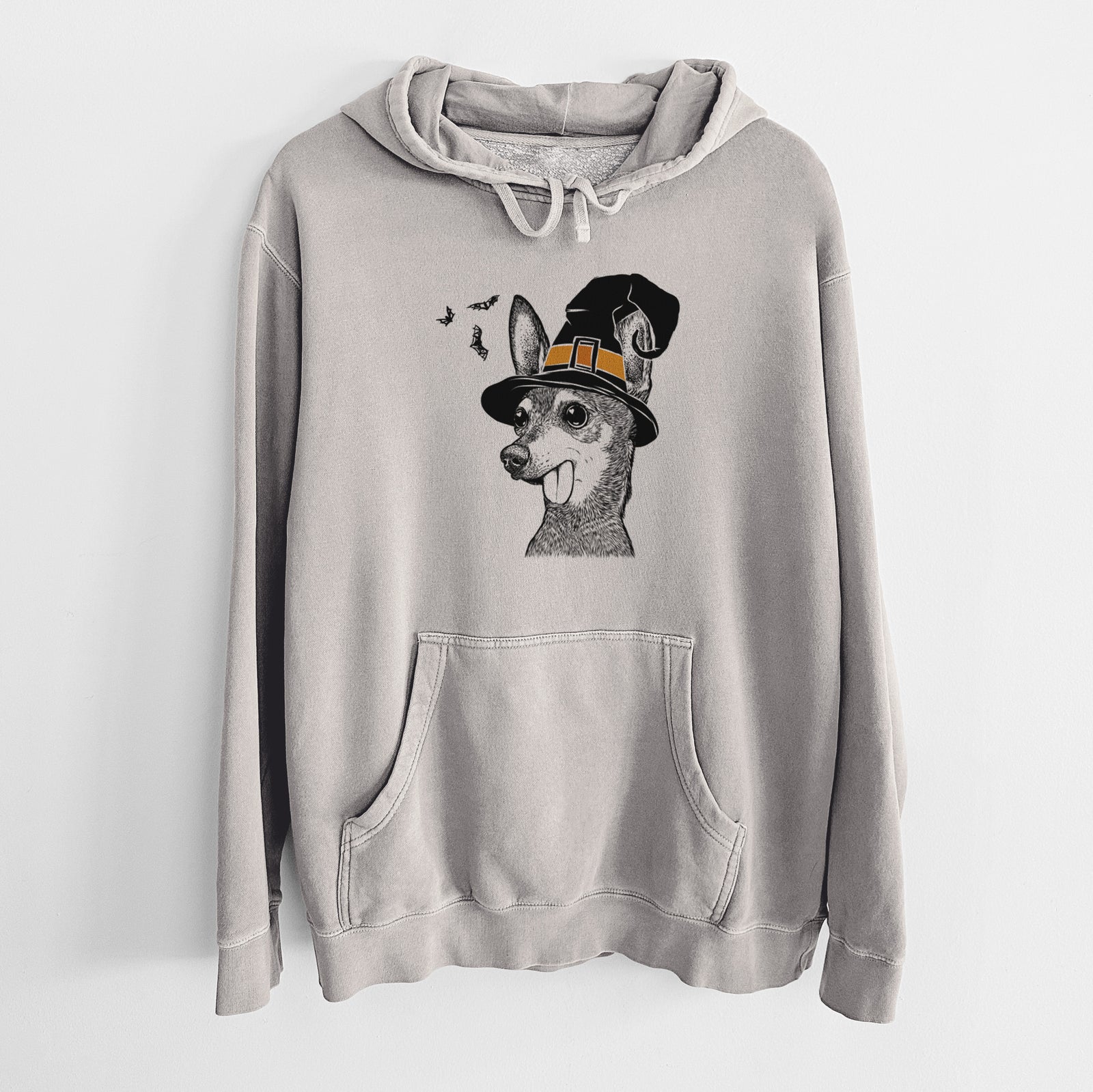 Hand-drawn sketch of Aaron the Chihuahua wearing a witch hat on a Cement Unisex pigment dyed hoodie
