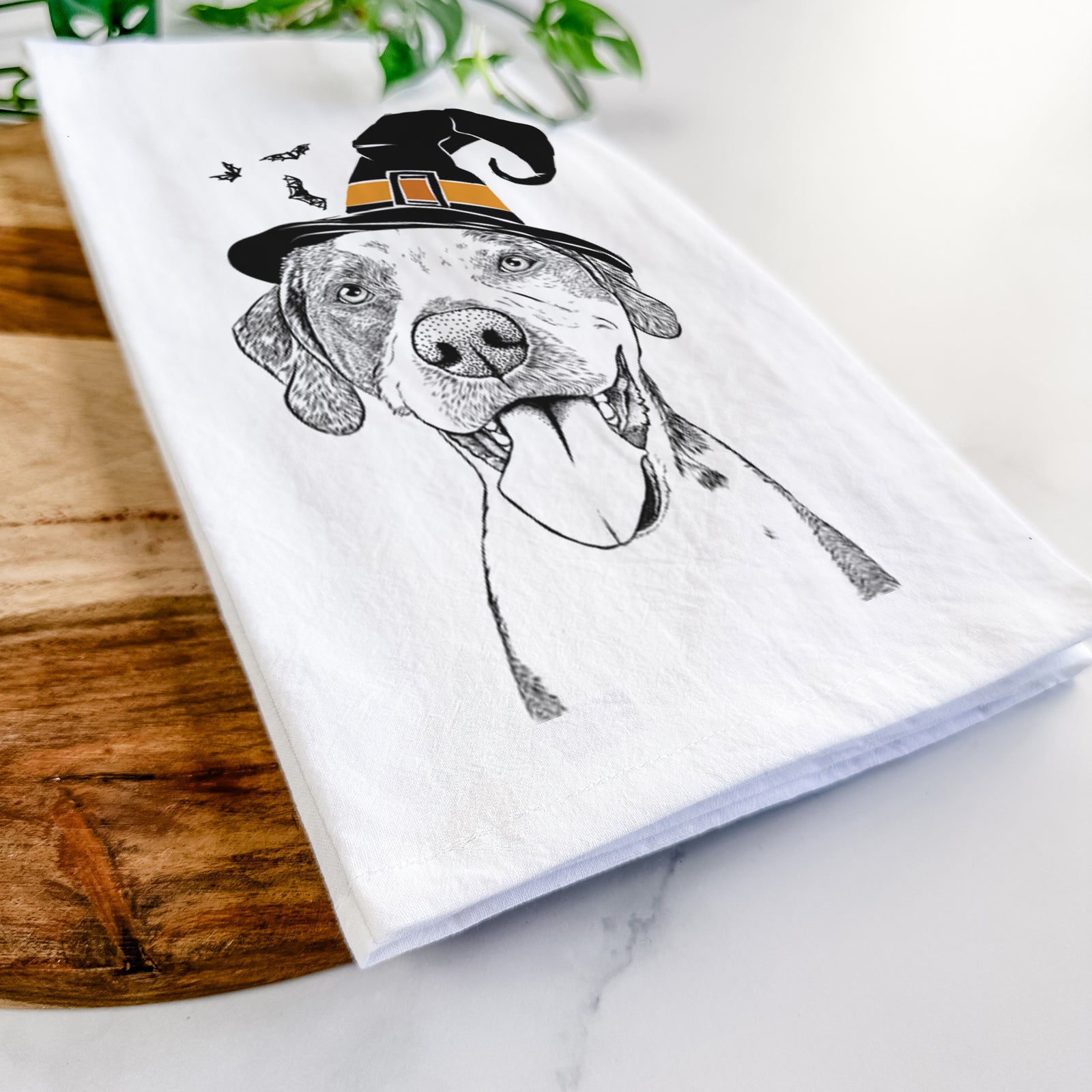 Hand-drawn sketch of Ace Boogie the Mixed Breed wearing a witch hat on a tea towel