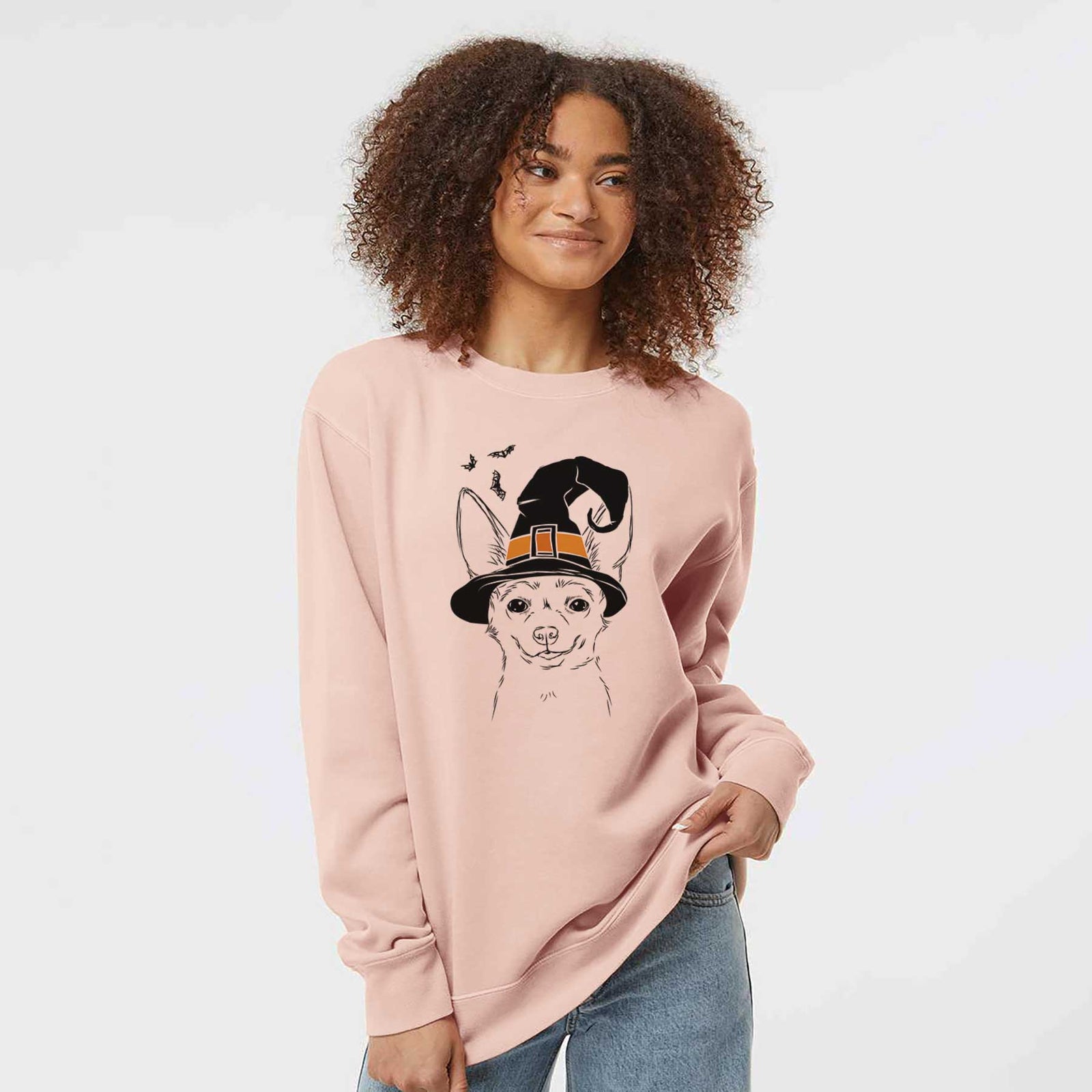 Hand-drawn sketch of Amos the Chihuahua wearing a witch hat on a Dusty Pink Unisex pigment dyed crew sweatshirt
