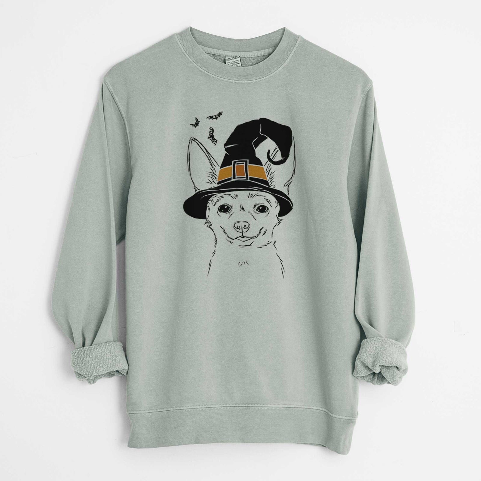 Hand-drawn sketch of Amos the Chihuahua wearing a witch hat on a Sage Unisex pigment dyed crew sweatshirt