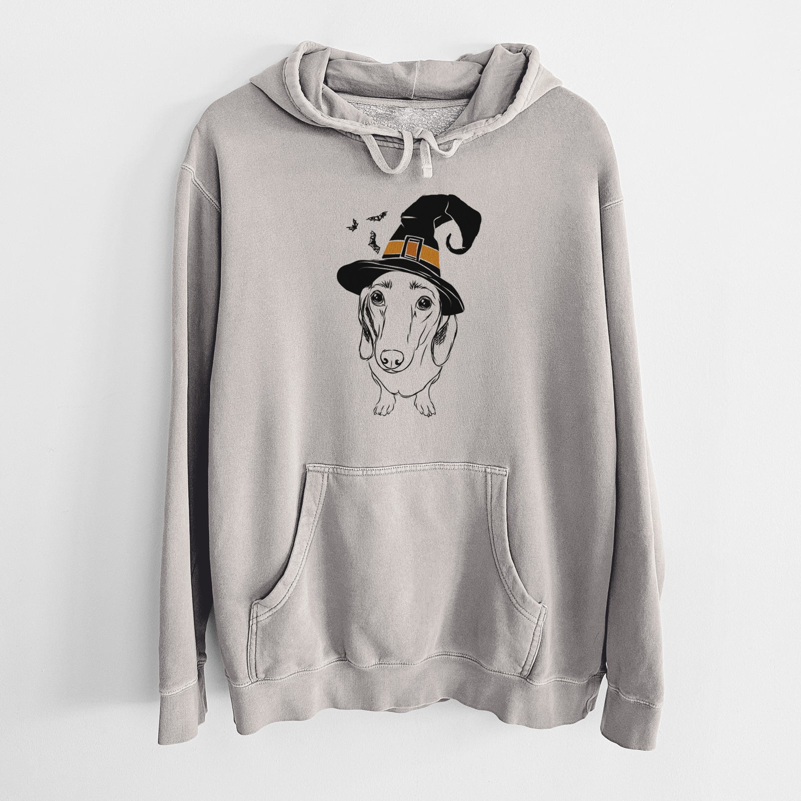 Hand-drawn sketch of Annabelle the Dachshund wearing a witch hat on a Cement Unisex pigment dyed hoodie