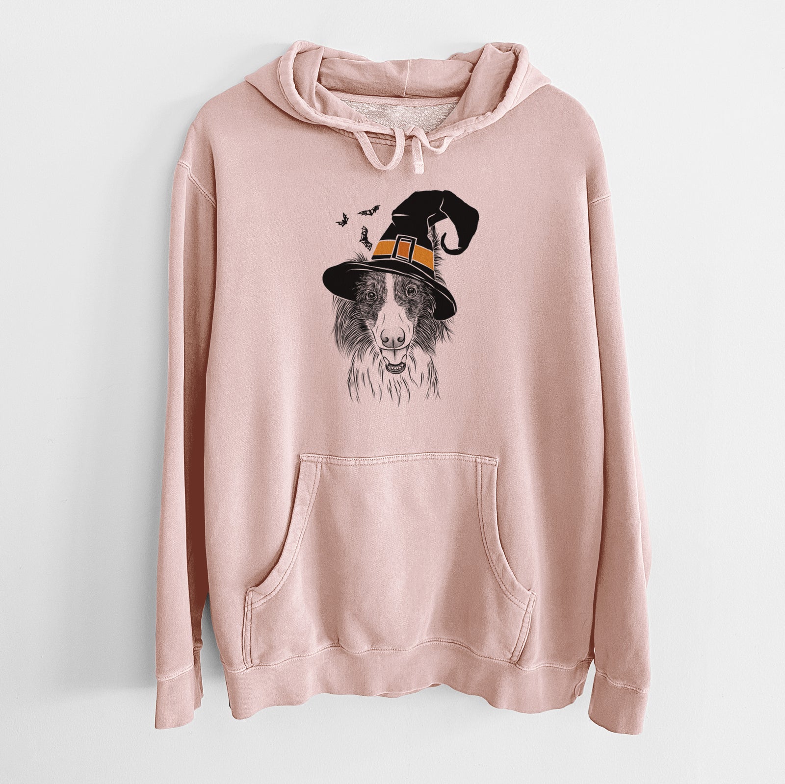 Hand-drawn sketch of Archie the Silken Windhound wearing a witch hat on a Dusty Pink Unisex pigment dyed hoodie