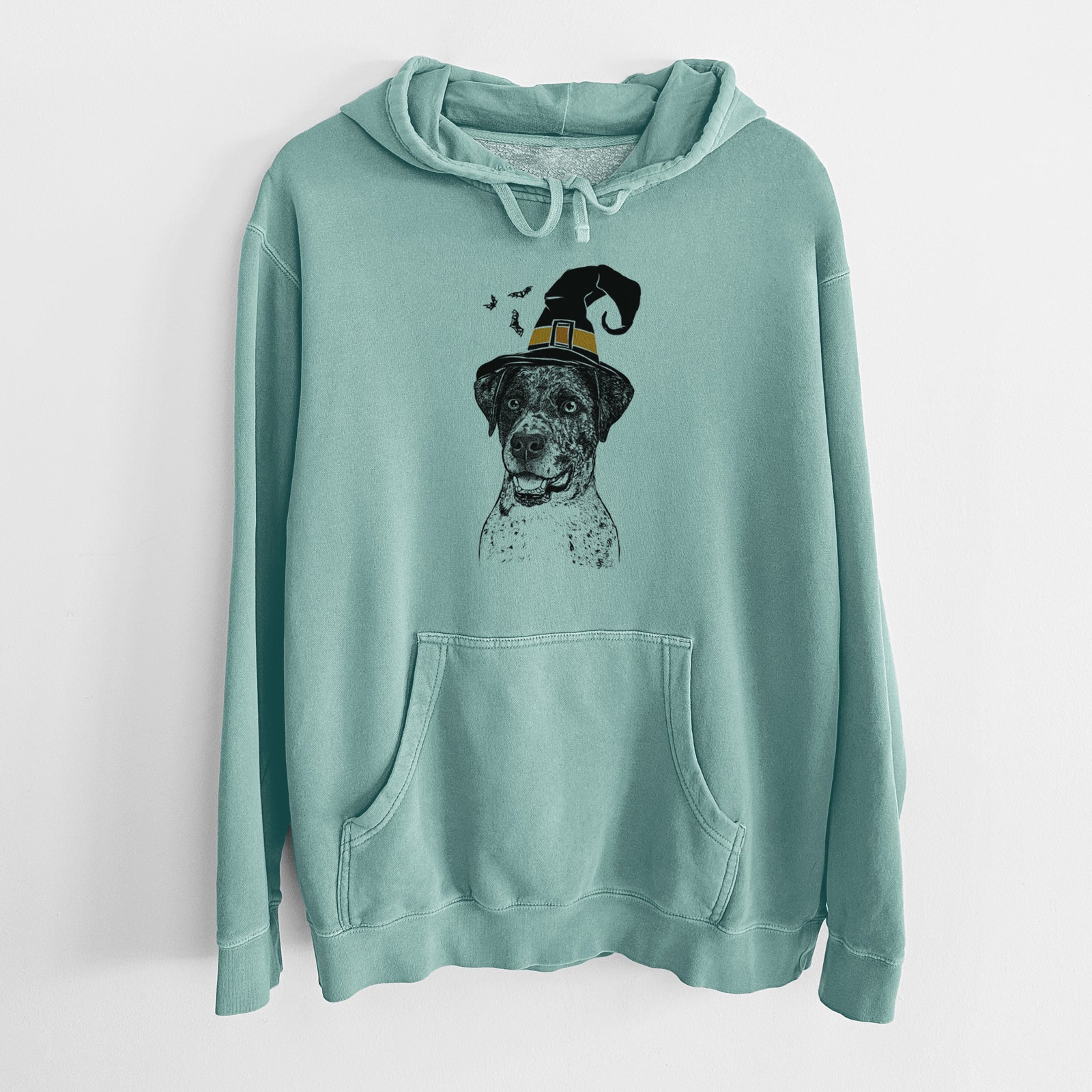 Hand-drawn sketch of Argos the Catahoula wearing a witch hat on a Mint Unisex pigment dyed hoodie