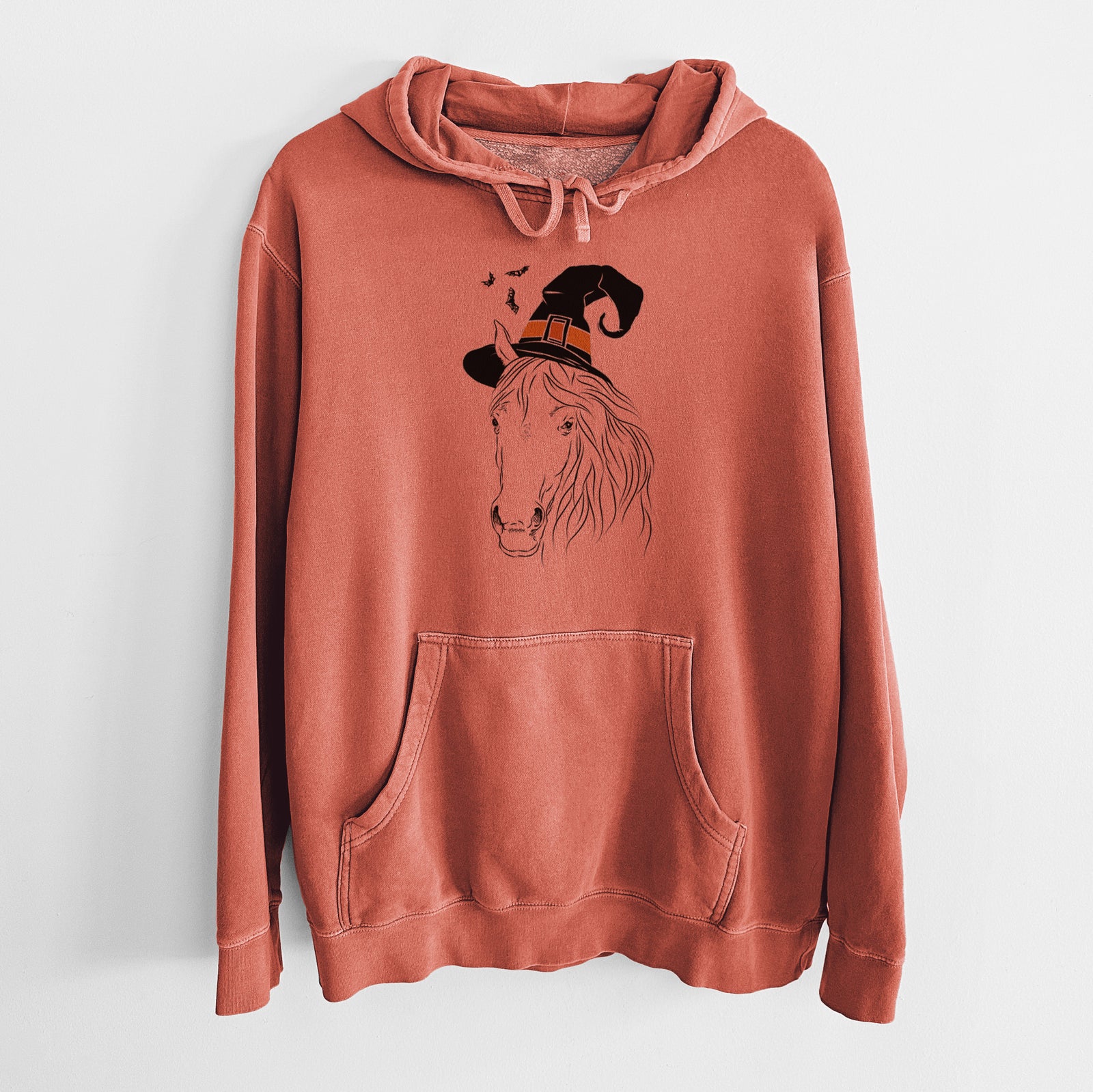 Hand-drawn sketch of Aria the Horse wearing a witch hat on an Amber Unisex pigment dyed hoodie