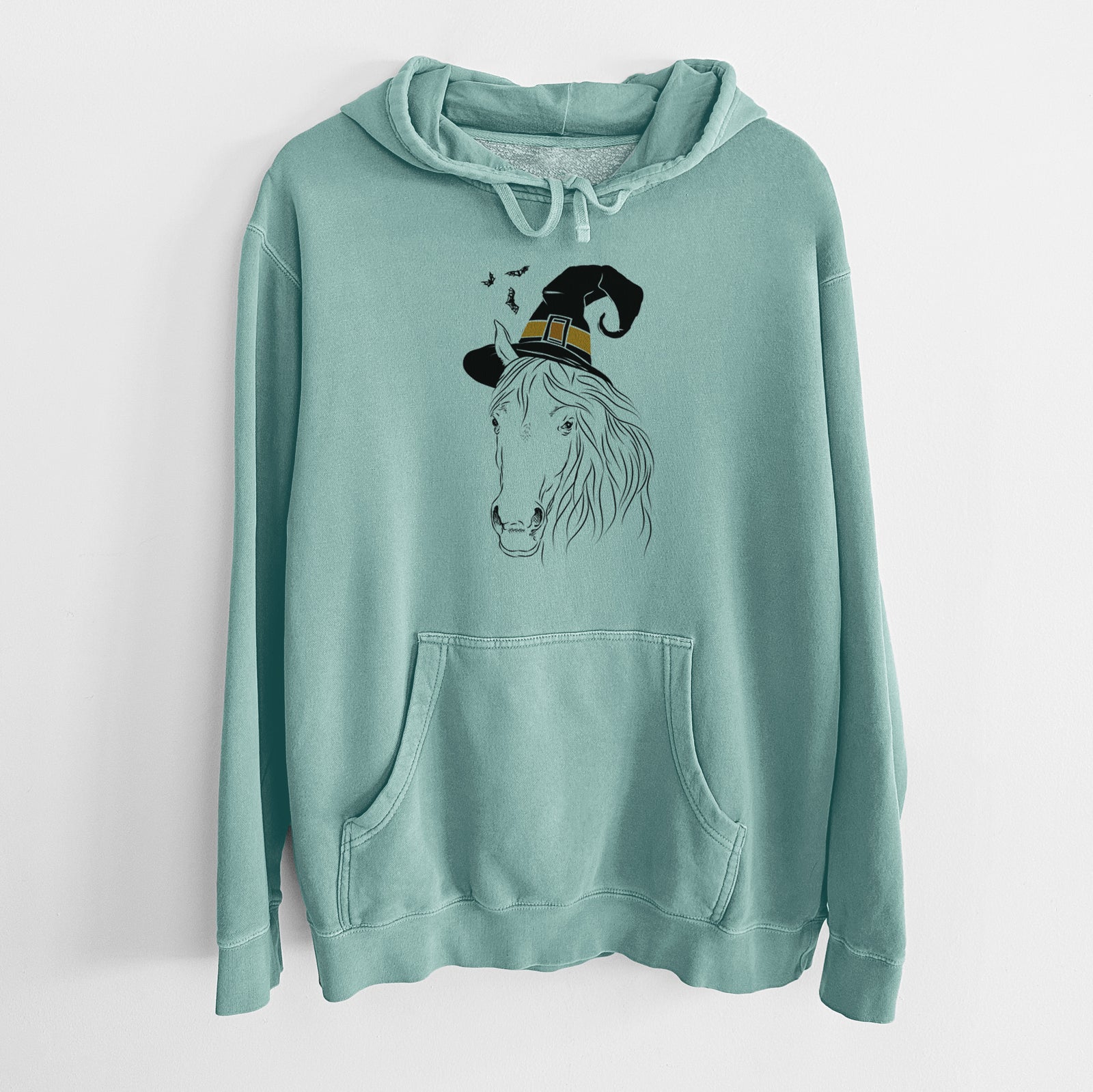 Hand-drawn sketch of Aria the Horse wearing a witch hat on a Mint Unisex pigment dyed hoodie