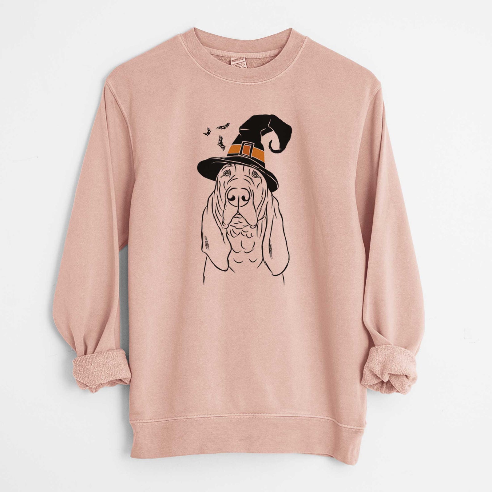 Hand-drawn sketch of Baron the Bloodhound wearing a witch hat on a Dusty Pink Unisex pigment dyed crew sweatshirt
