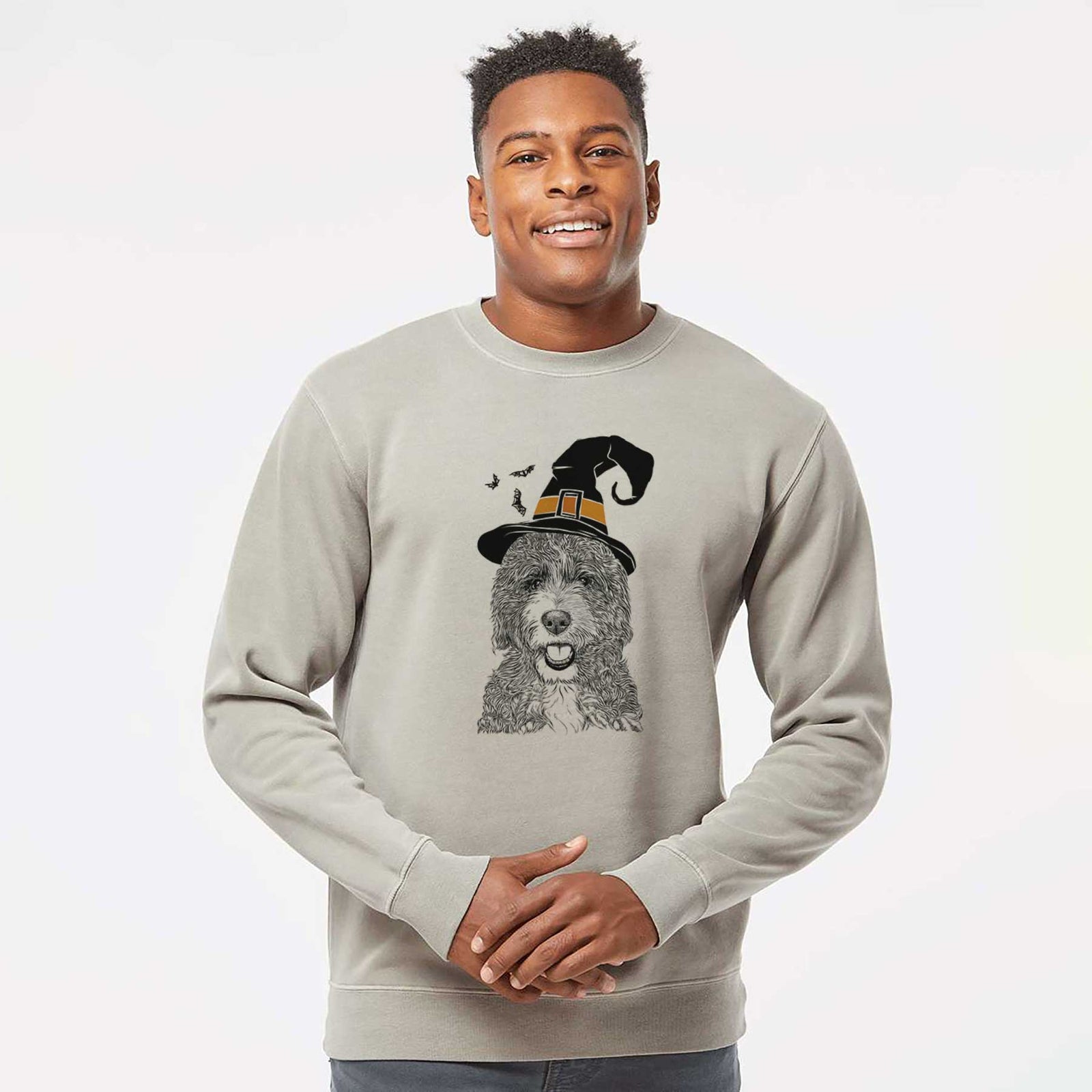 Hand-drawn sketch of Bash the Bernedoodle wearing a witch hat on a Cement Unisex pigment dyed crew sweatshirt