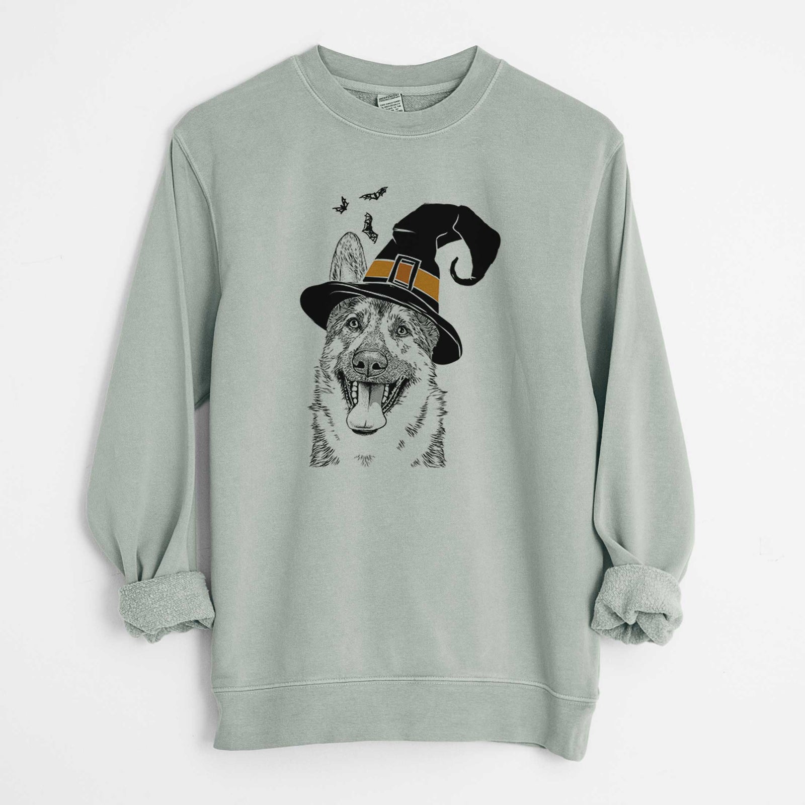 Hand-drawn sketch of Benson the German Shepherd wearing a witch hat on a Sage Unisex pigment dyed crew sweatshirt