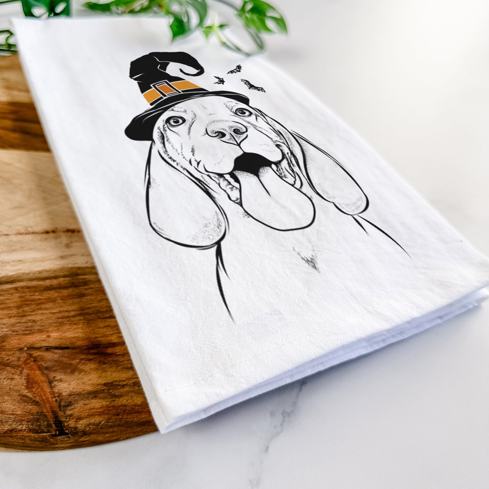 Hand-drawn sketch of Bodi the Vizsla wearing a witch hat on a tea towel