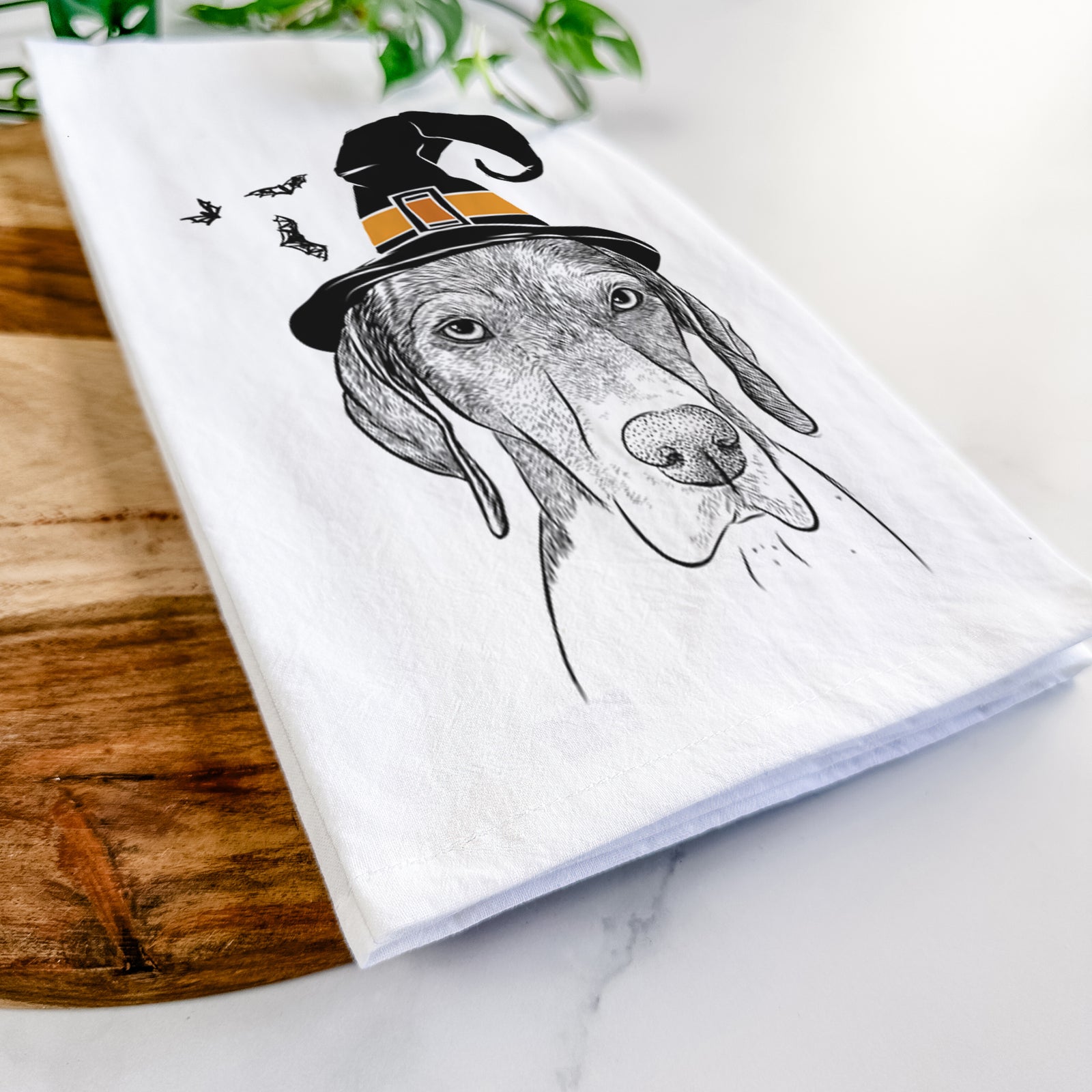 Hand-drawn sketch of Bohdi the German Shorthaired Pointer wearing a witch hat on a tea towel