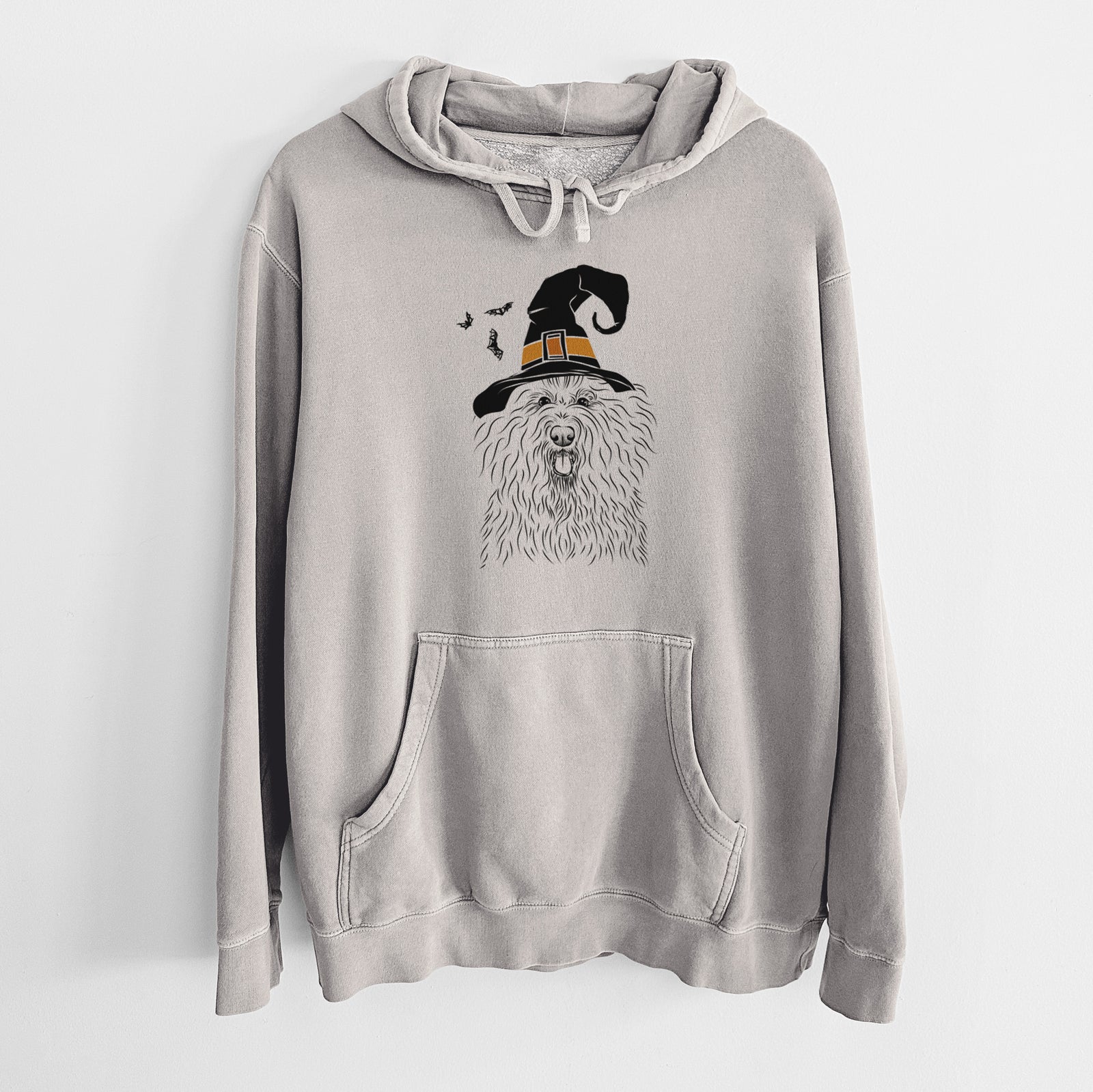 Hand-drawn sketch of Brody the Old English Sheepdog wearing a witch hat on a Cement Unisex pigment dyed hoodie