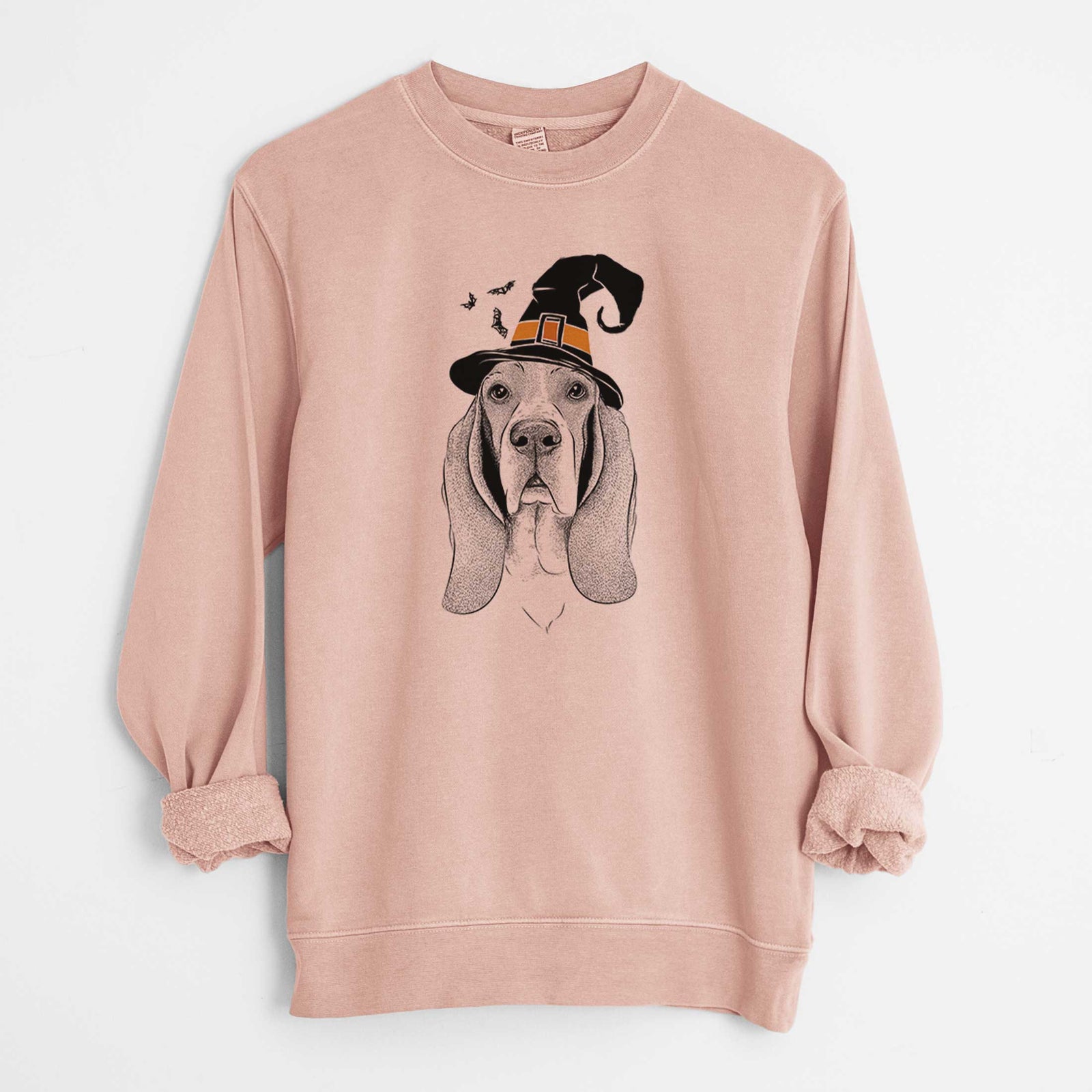 Hand-drawn sketch of Buckley the Basset Hound wearing a witch hat on a Dusty Pink Unisex pigment dyed crew sweatshirt