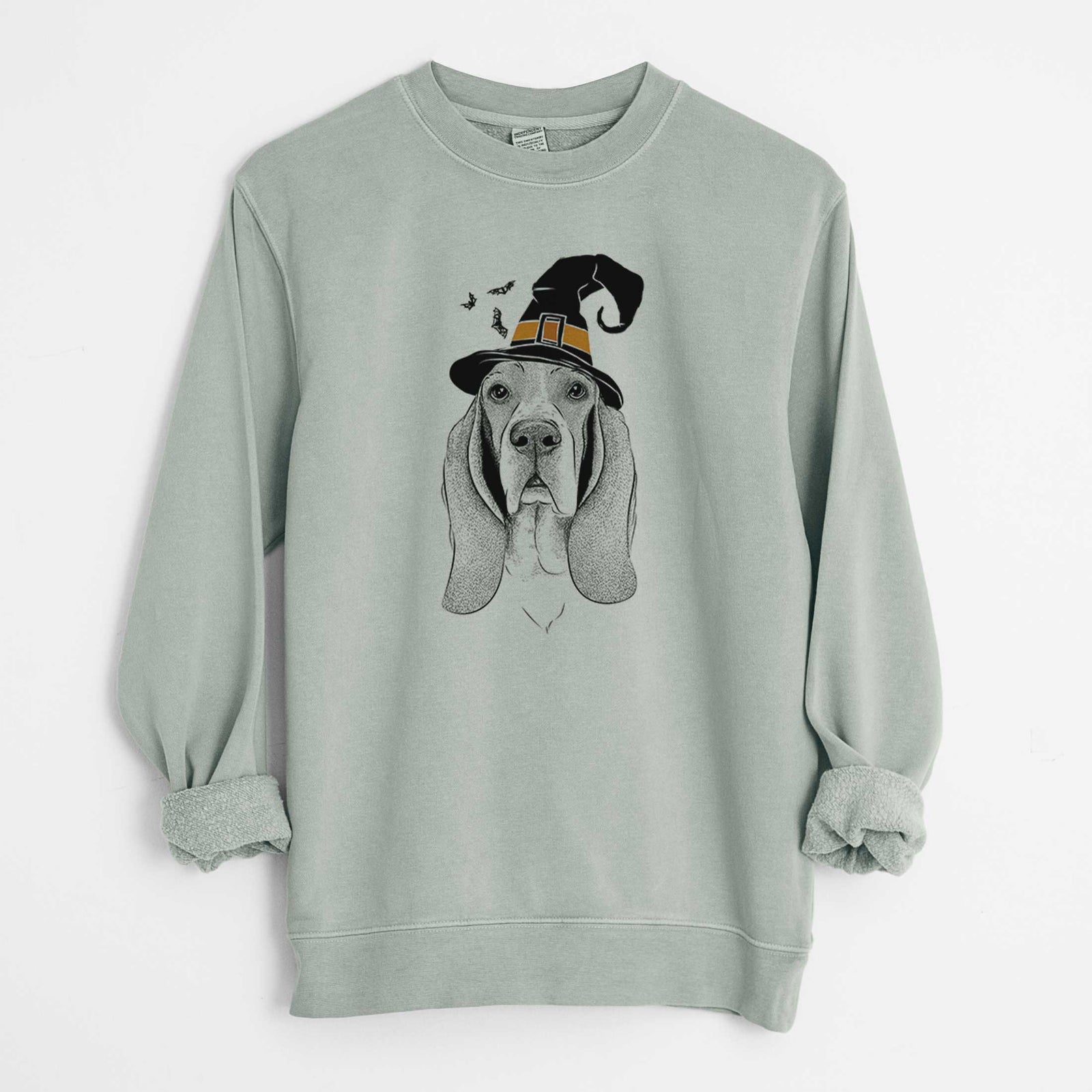 Hand-drawn sketch of Buckley the Basset Hound wearing a witch hat on a Sage Unisex pigment dyed crew sweatshirt