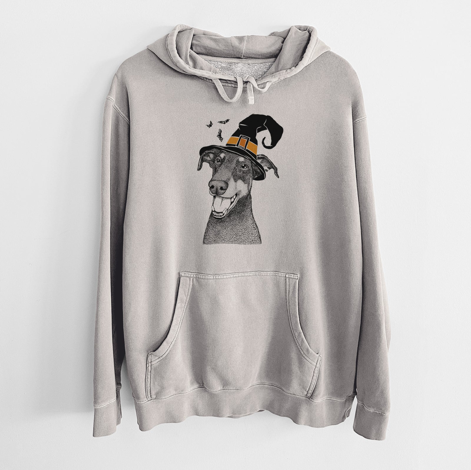 Hand-drawn sketch of Bunnie the Doberman Pinscher wearing a witch hat on a Cement Unisex pigment dyed hoodie