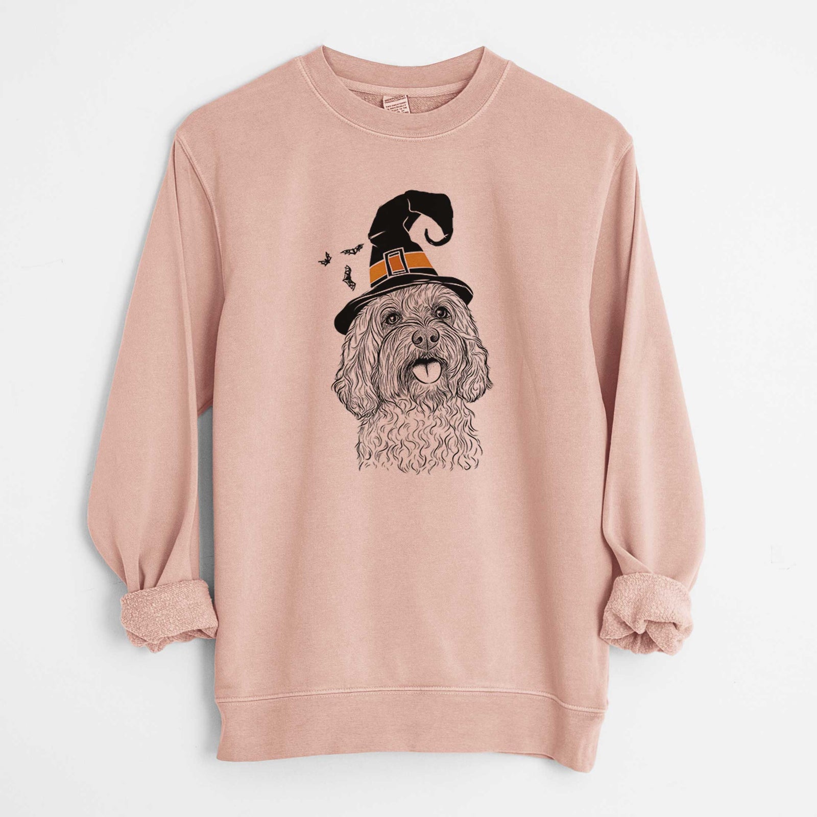Hand-drawn sketch of Cali the Cavapoo wearing a witch hat on a Dusty Pink Unisex pigment dyed crew sweatshirt
