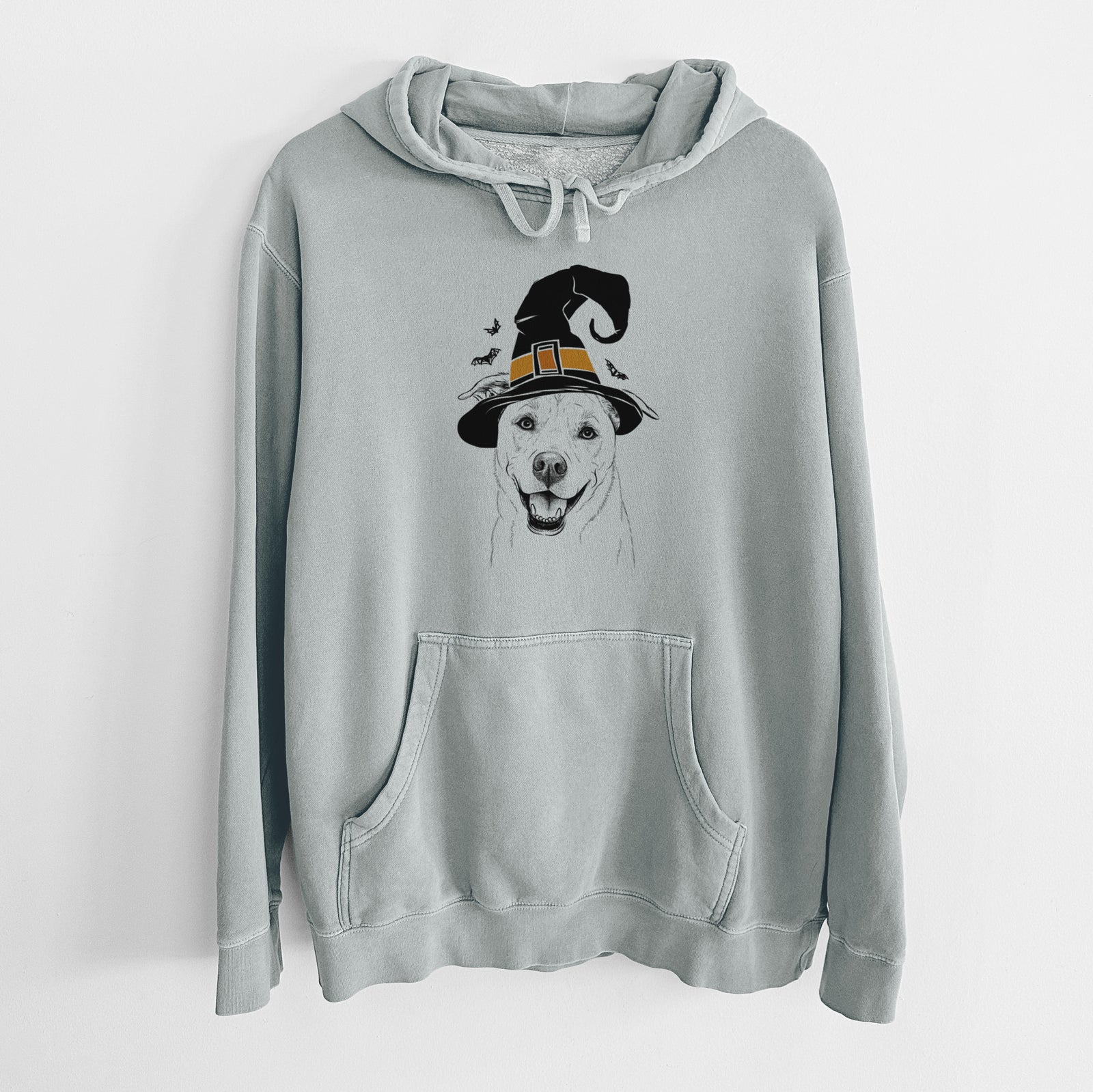 Hand-drawn sketch of Carl the Mixed Breed wearing a witch hat on a Sage Unisex pigment dyed hoodie