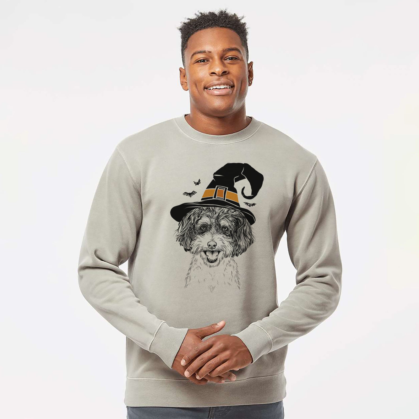 Hand-drawn sketch of Carlos the Cavapoo wearing a witch hat on a Cement Unisex pigment dyed crew sweatshirt