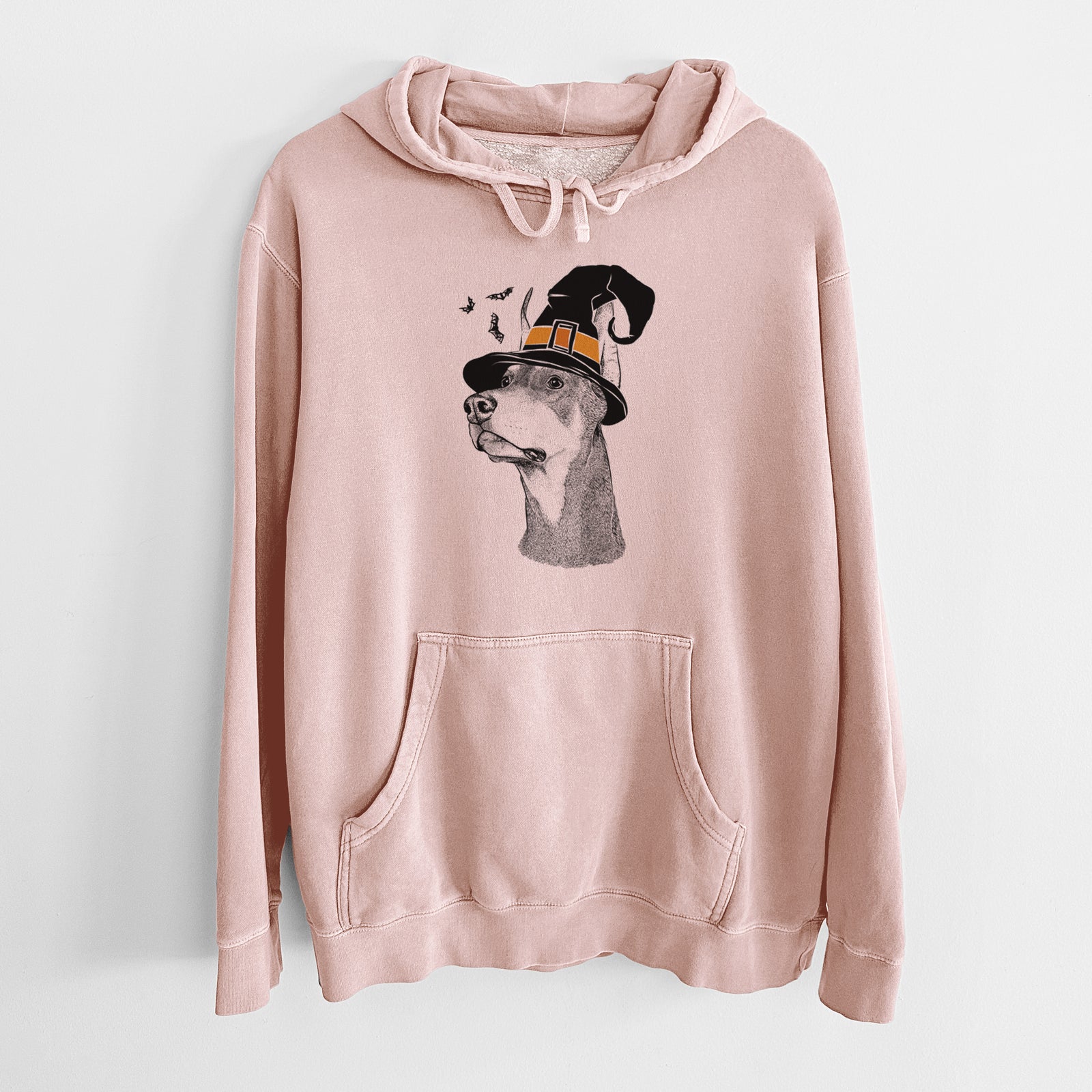 Hand-drawn sketch of Cenza the Doberman Pinscher wearing a witch hat on a Dusty Pink Unisex pigment dyed hoodie