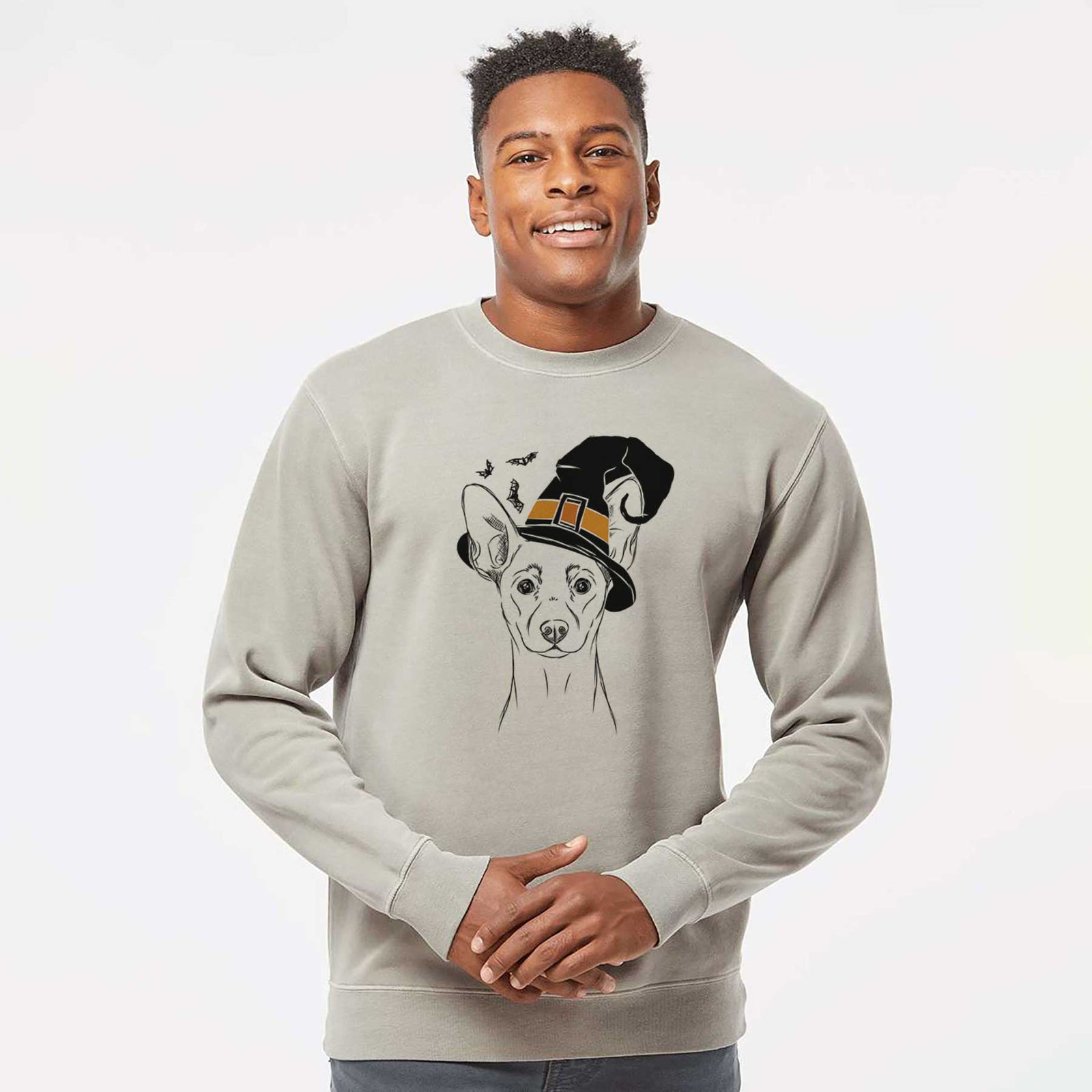 Hand-drawn sketch of Chillie the Mini Pinscher wearing a witch hat on a Cement Unisex pigment dyed crew sweatshirt