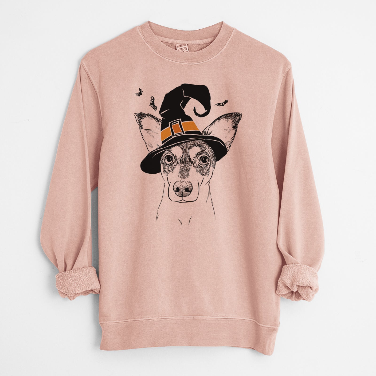 Hand-drawn sketch of Chloe the Doxie Mix wearing a witch hat on a Dusty Pink Unisex pigment dyed crew sweatshirt
