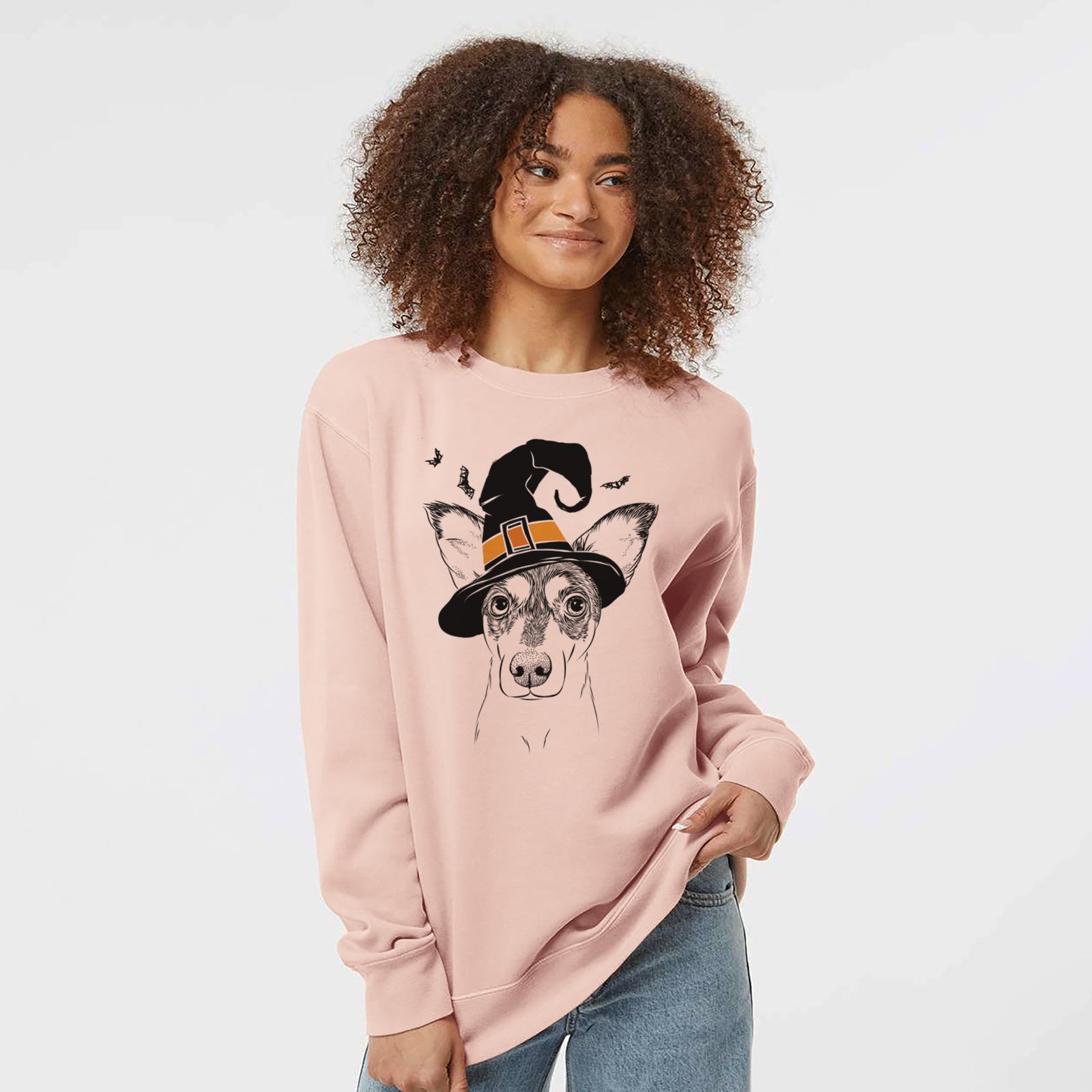 Hand-drawn sketch of Chloe the Doxie Mix wearing a witch hat on a Dusty Pink Unisex pigment dyed crew sweatshirt