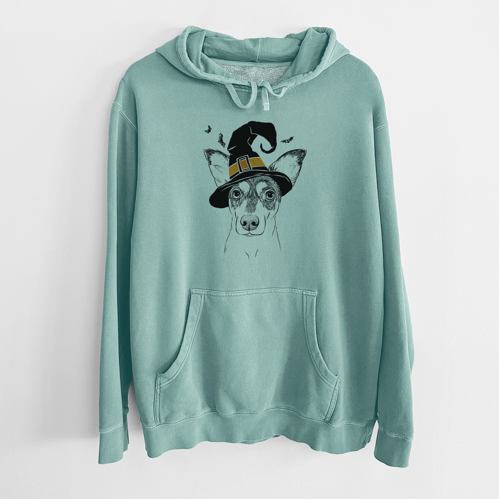 Hand-drawn sketch of Chloe the Doxie Mix wearing a witch hat on a Mint Unisex pigment dyed hoodie