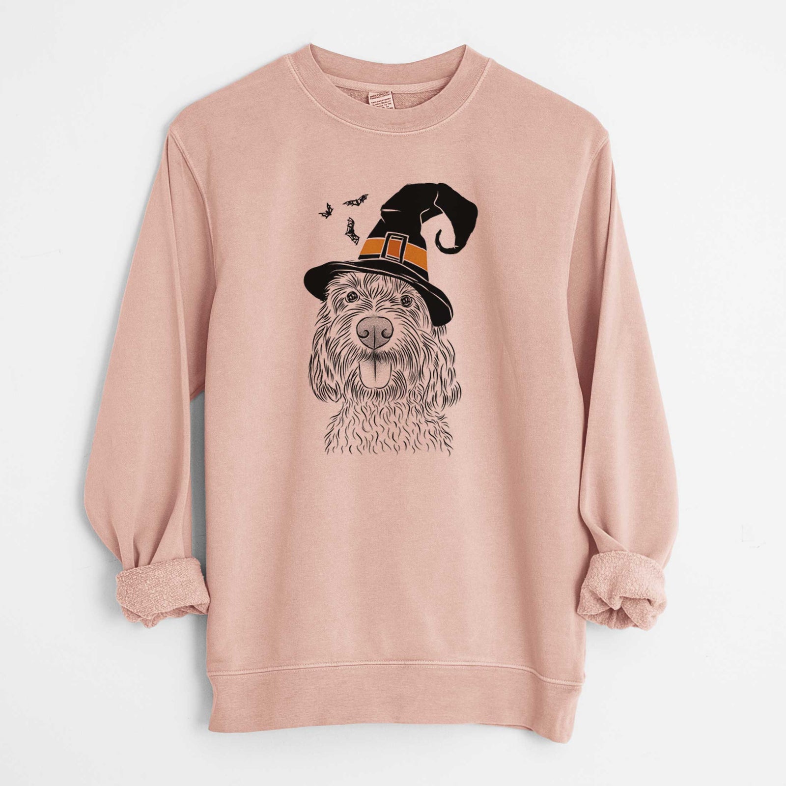 Hand-drawn sketch of Clover the Cockapoo wearing a witch hat on a Dusty Pink Unisex pigment dyed crew sweatshirt