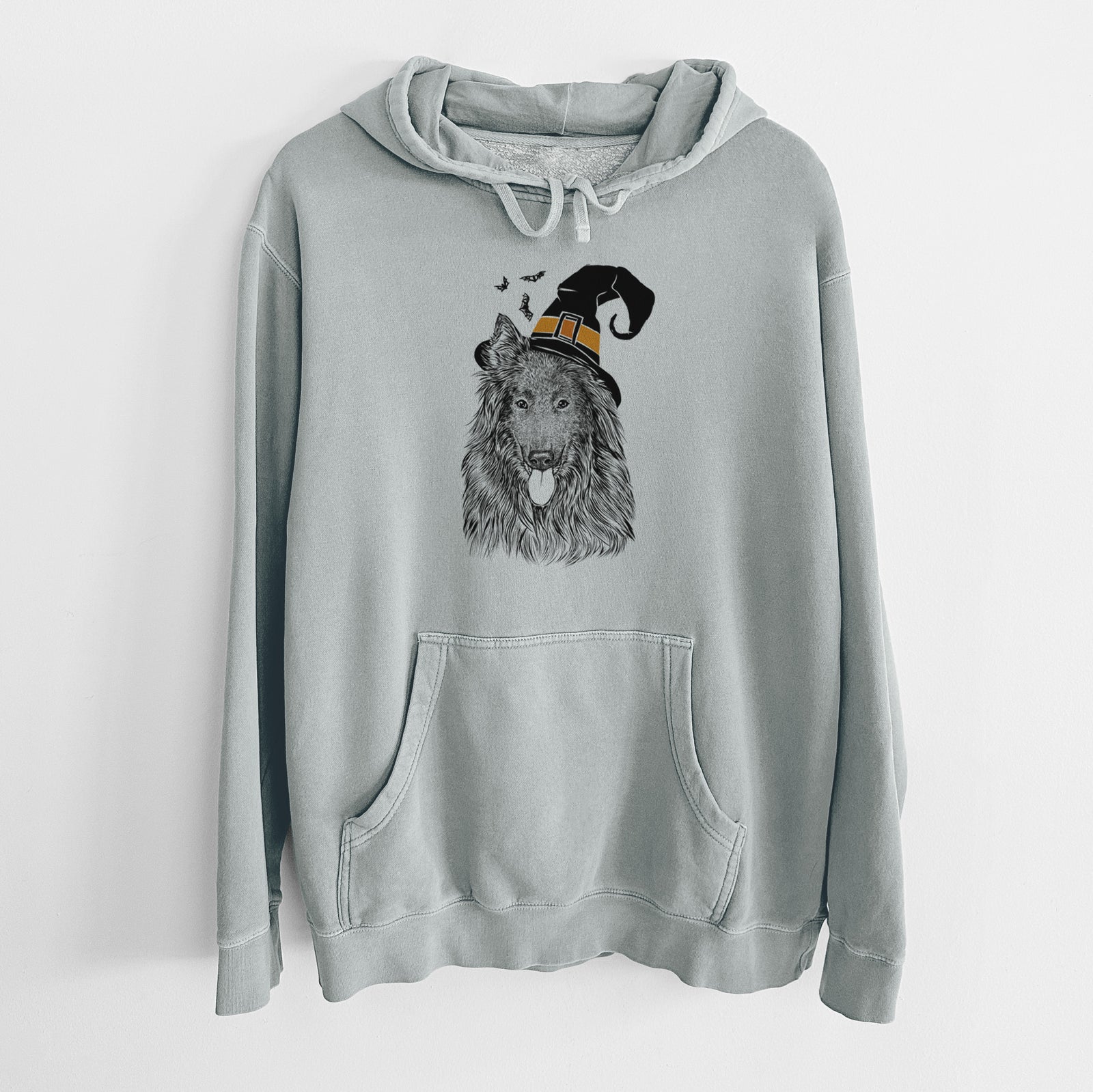 Hand-drawn sketch of Daan the Belgian Shepherd wearing a witch hat on a Sage Unisex pigment dyed hoodie