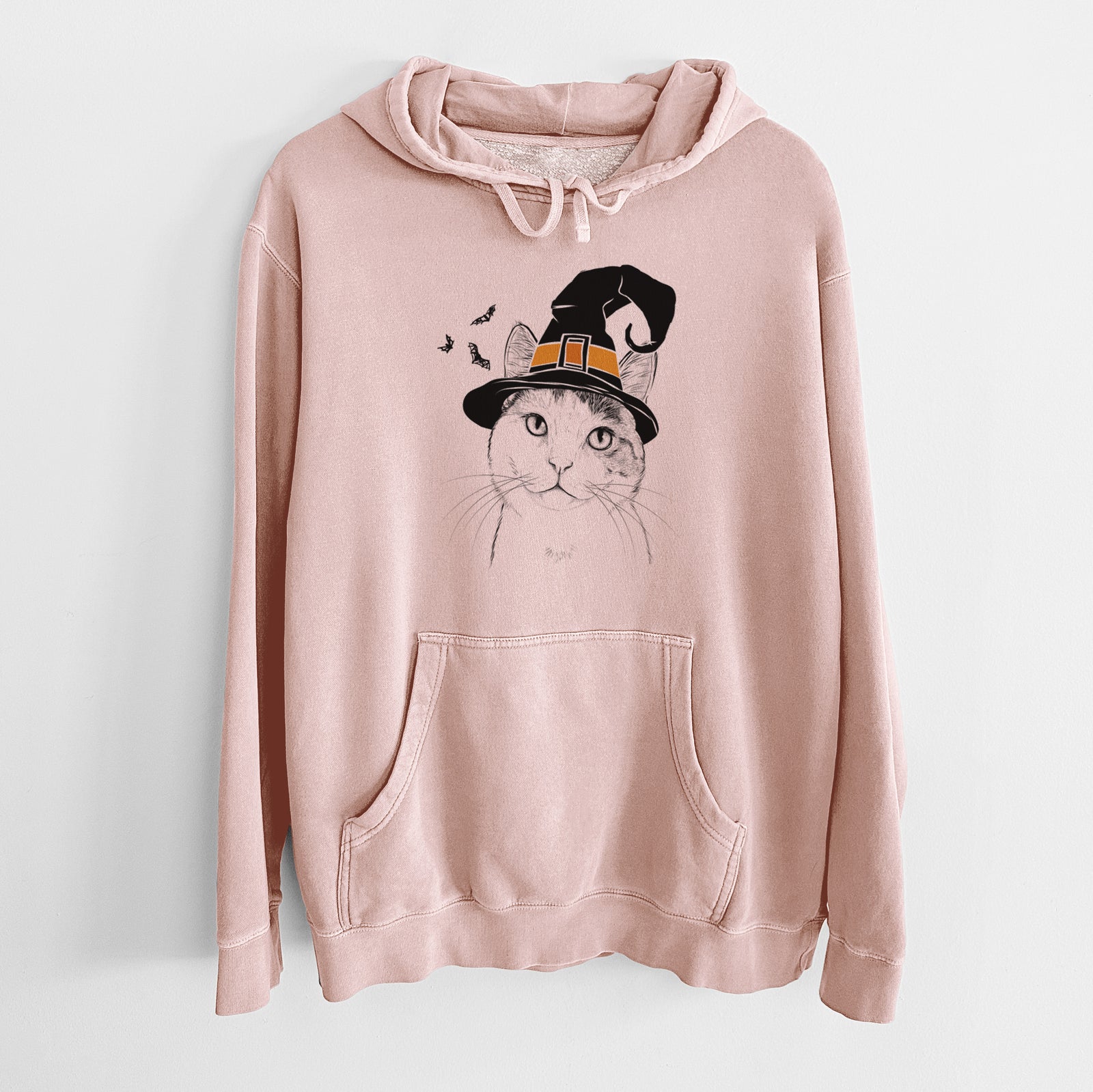 Hand-drawn sketch of Denver the Calico Cat wearing a witch hat on a Dusty Pink Unisex pigment dyed hoodie